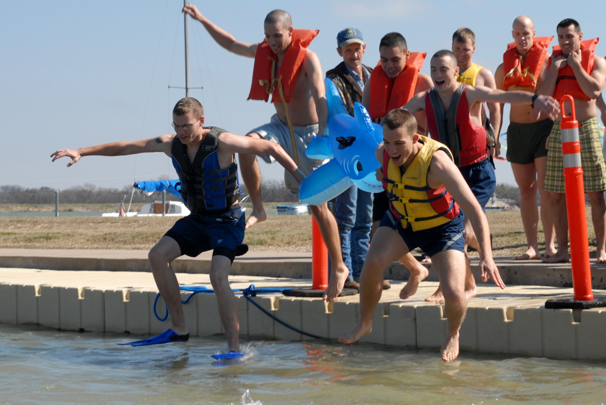 SAN ANGELO, Texas -- Goodfellow Air Force Base members jump into Lake Nasworthy during the annual Polar Bear Swim at the Goodfellow AFB Recreation Camp, Feb. 6, 2010. More than 180 Goodfellow AFB members participated in this event. Water temperature was 33 degrees. (U.S. Air Force photo/Staff Sgt. Laura R. McFarlane)

