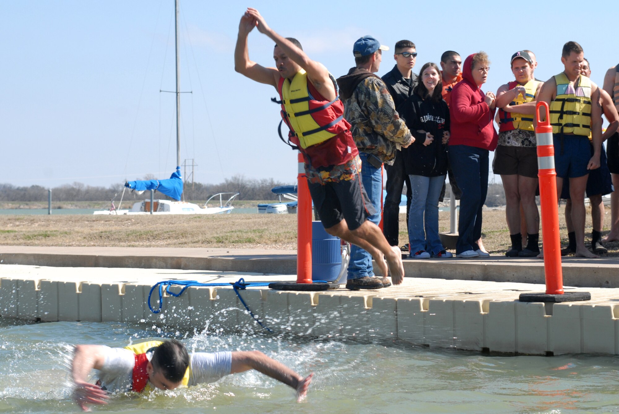 SAN ANGELO, Texas -- Master Sgt. John Guidry, 316th Training Squadron first sgt., jumps into Lake Nasworthy during the annual Polar Bear Swim at the Goodfellow Air Force Base Recreation Camp, Feb. 6, 2010. More than 180 Goodfellow AFB members participated in this event. Water temperature was 33 degrees. (U.S. Air Force photo/Staff Sgt. Laura R. McFarlane)
