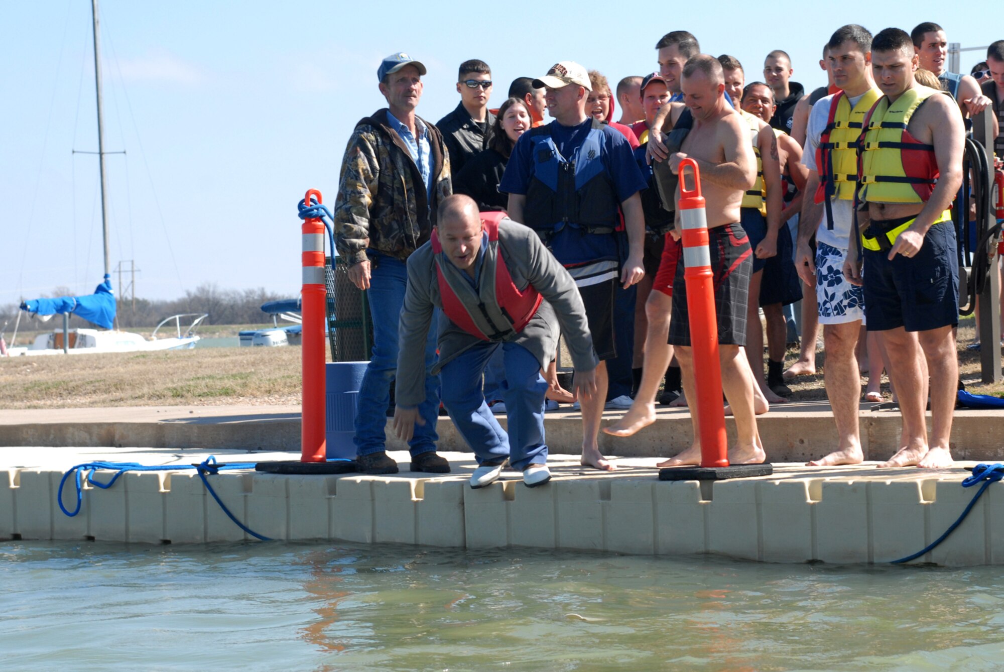 SAN ANGELO, Texas -- Chief Master Sgt. Robert Puhl, 17th Training Group chief enlisted manager, dives into Lake Nasworthy during the annual Polar Bear Swim at the Goodfellow Air Force Base Recreation Camp, Feb. 6, 2010. More than 180 Goodfellow AFB members participated in this event. Water temperature was 33 degrees. (U.S. Air Force photo/Staff Sgt. Laura R. McFarlane)
