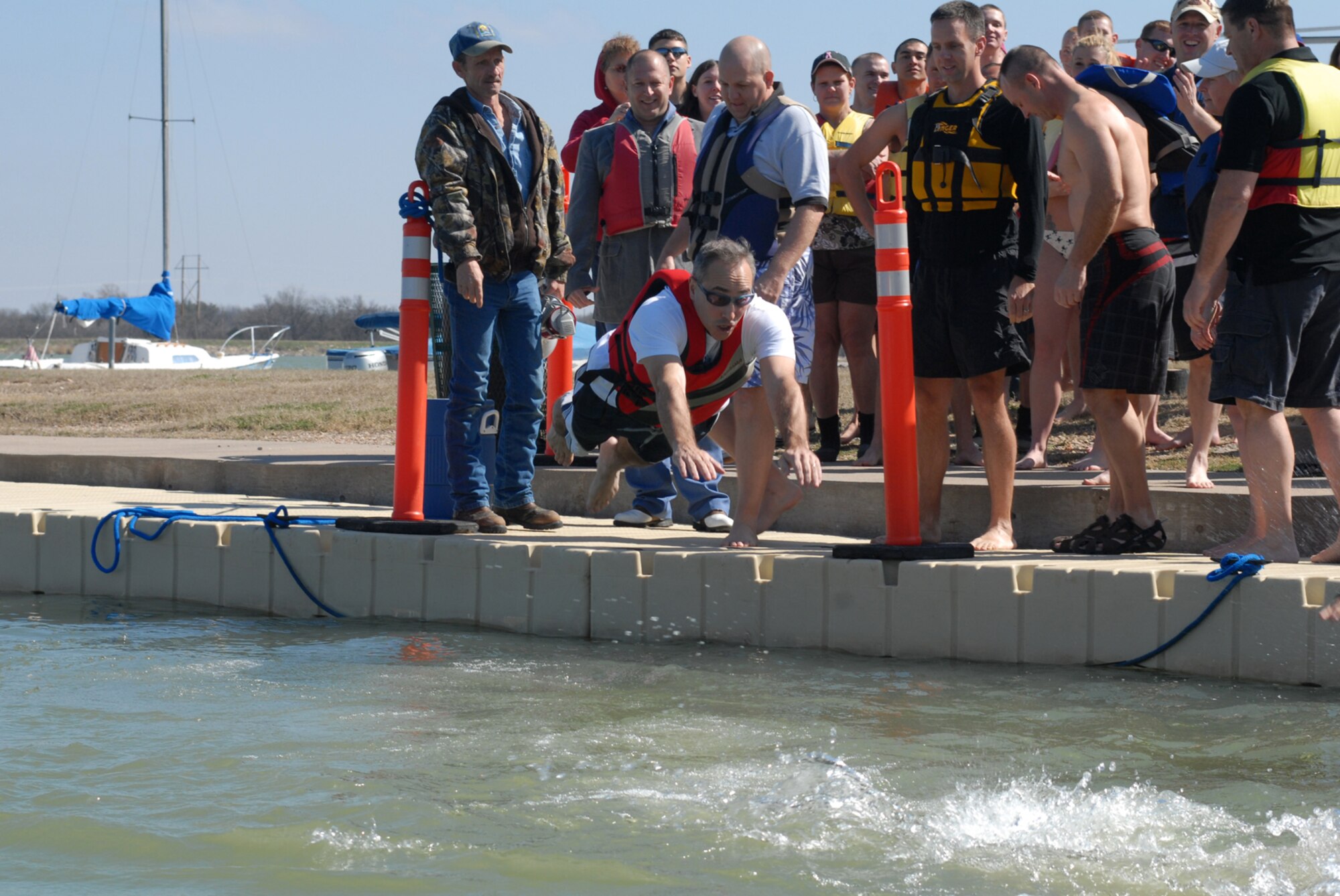 SAN ANGELO, Texas -- Col. Anthony Lombardo, 17th Training Group commander, dives into Lake Nasworthy during the annual Polar Bear Swim at the Goodfellow Air Force Base Recreation Camp, Feb. 6, 2010. More than 180 Goodfellow AFB members participated in this event. Water temperature was 33 degrees. (U.S. Air Force photo/Staff Sgt. Laura R. McFarlane)
