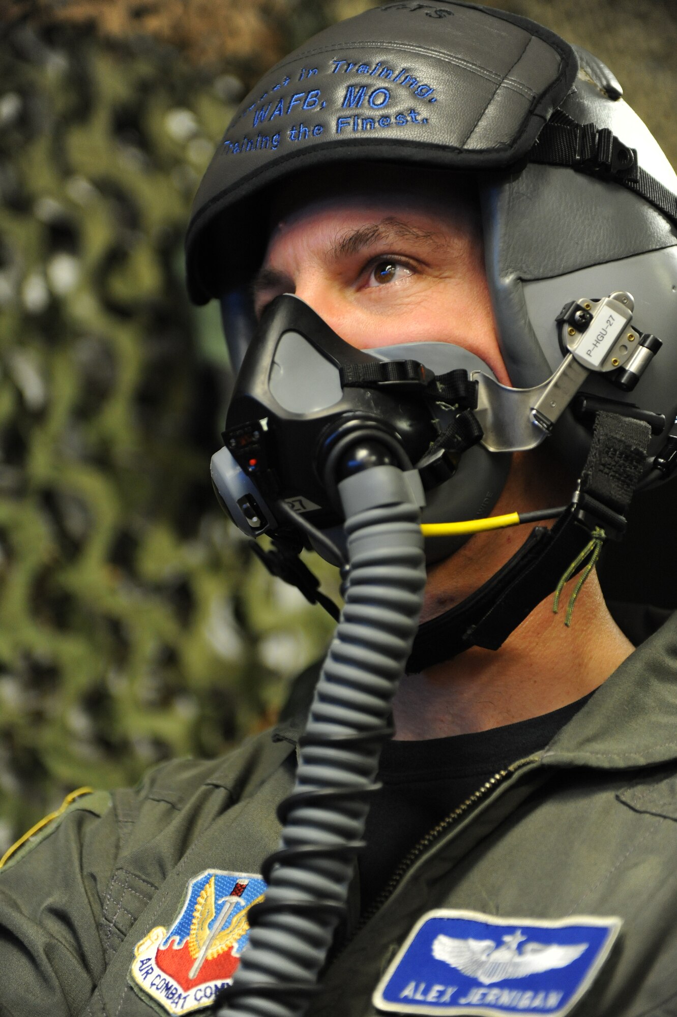 WHITEMAN AIR FORCE BASE, Mo. - Maj. Alex Jernigan, Detachment 12 commander, is supplied oxygen during hypoxia recognition training, Feb. 8, 2010. The training is used as a refresher course in recognizing individual signs of hypoxia, a deficiency of oxygen to the body that is sufficient enough to cause an impairment of function. (U.S. Air Force photo/Airman 1st Class Carlin Leslie)(Released)






