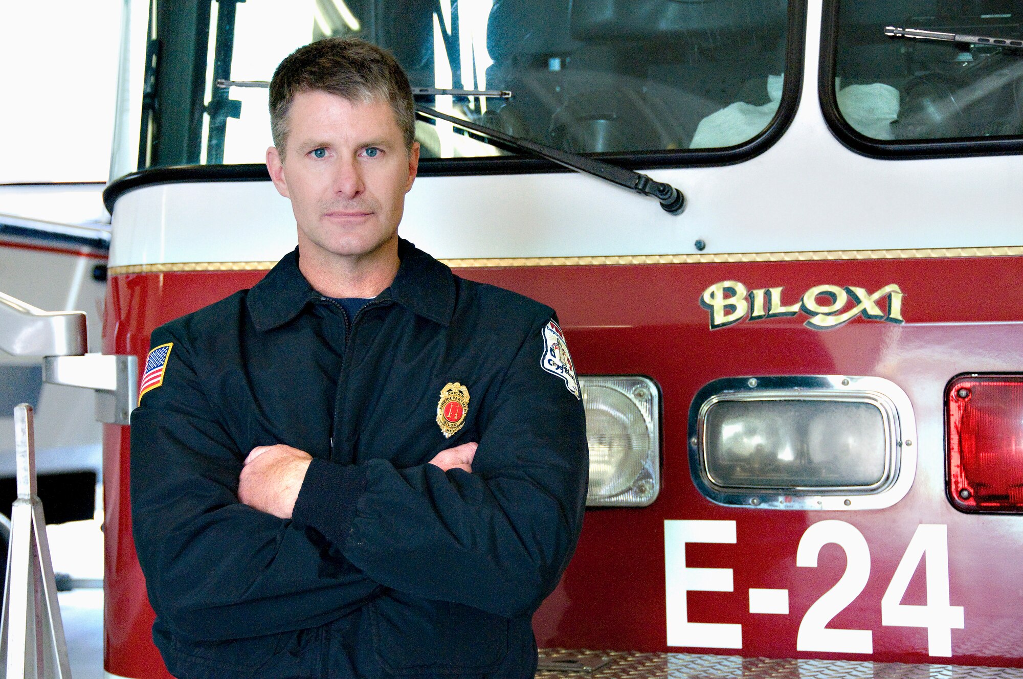 Master Sgt. Mark Toepfer, a 403rd Civil Engineer Squadron firefighter, stands in front a fire truck at the Biloxi Fire Department. For more than 15 years, Sergeant Toepfer has worked as a full time firefighter and shift captain there. (U.S. Air Force Photo by Senior Airman Kimberly Erickson)