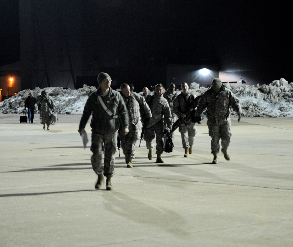 LANGLEY AIR FORCE BASE, Va. - Personnel from Fort Lee, Va. prepare to load onto a C-17 Globemaster III Feb. 8 through a joint effort by Fort Eustis and Langley Air Force Base. The personnel and cargo are being transported to Haiti as part of Operation Unified Response, a massive relief effort to aid the devastated country. (U.S. Air Force Photo/Senior Airman Dana Hill)