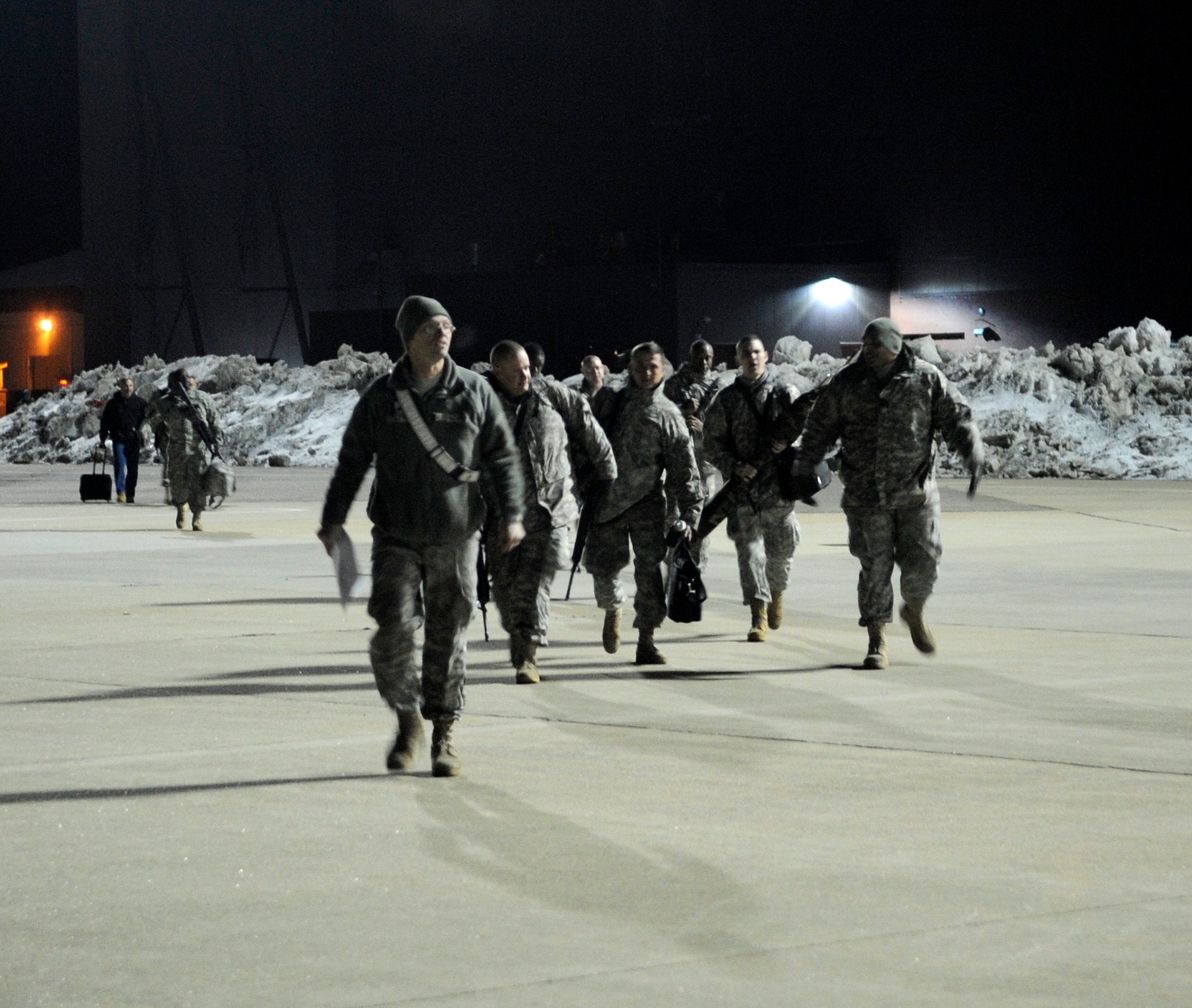 LANGLEY AIR FORCE BASE, Va. - Personnel from Fort Lee, Va. prepare to load onto a C-17 Globemaster III Feb. 8 through a joint effort by Fort Eustis and Langley Air Force Base. The personnel and cargo are being transported to Haiti as part of Operation Unified Response, a massive relief effort to aid the devastated country. (U.S. Air Force Photo/Senior Airman Dana Hill)
