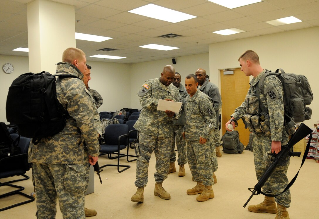 LANGLEY AIR FORCE BASE, Va. - Personnel from Fort Lee, Va. prepare to load onto a C-17 Globemaster III Feb. 8 through a joint effort by Fort Eustis and Langley Air Force Base. The personnel and cargo are being transported to Haiti as part of Operation Unified Response, a massive relief effort to aid the devastated country. (U.S. Air Force Photo/Senior Airman Dana Hill)