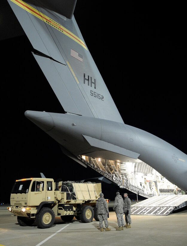 LANGLEY AIR FORCE BASE, Va. - Personnel and cargo from Fort Lee, Va. is prepared and loaded onto a C-17 Globemaster III Feb. 8 through a joint effort by Fort Eustis and Langley Air Force Base. The personnel and cargo are being transported to Haiti as part of Operation Unified Response, a massive relief effort to aid the devastated country. (U.S. Air Force Photo/Senior Airman Dana Hill)