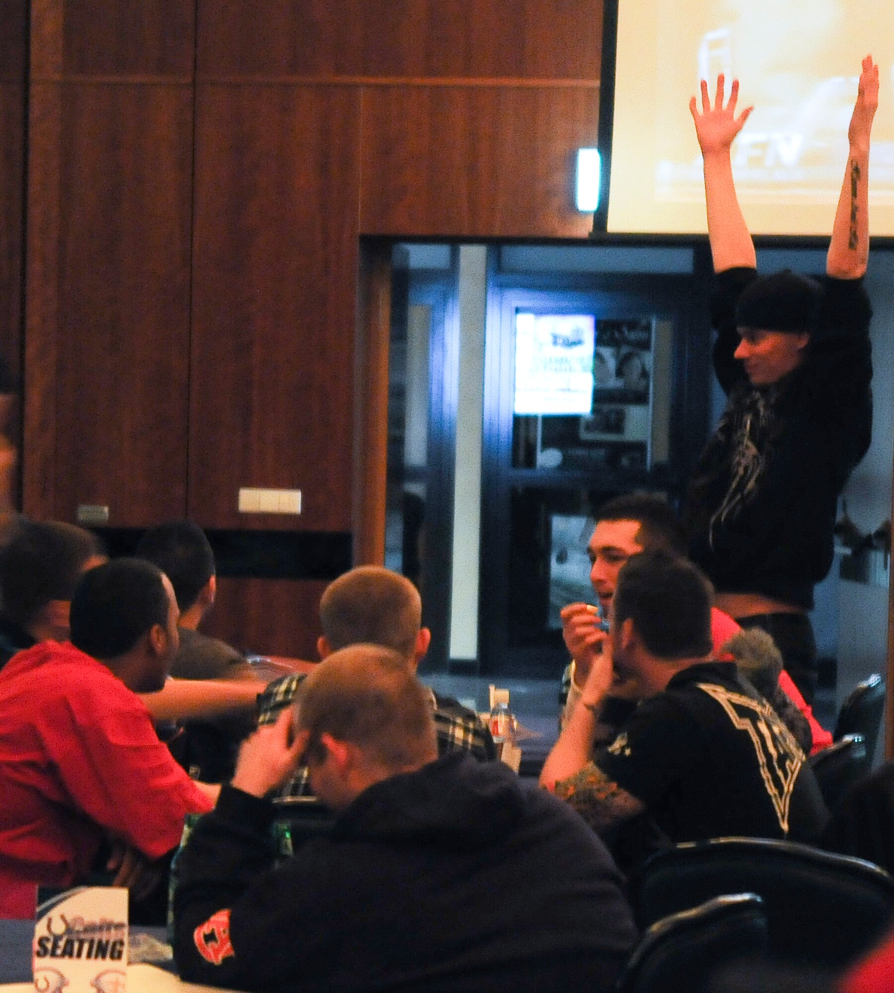 SPANGDAHLEM AIR BASE, Germany – New Orleans Saints fans celebrate after Saints cornerback Tracy Porter intercepts a touchdown pass late in the fourth quarter during the Super Bowl XLIV showing Feb. 7 at Club Eifel. Club Eifel hosted a Super Bowl party for members of the 52nd Fighter Wing, which included food, games and prizes. (U.S. Air Force photo/Senior Airman Nathanael Callon)