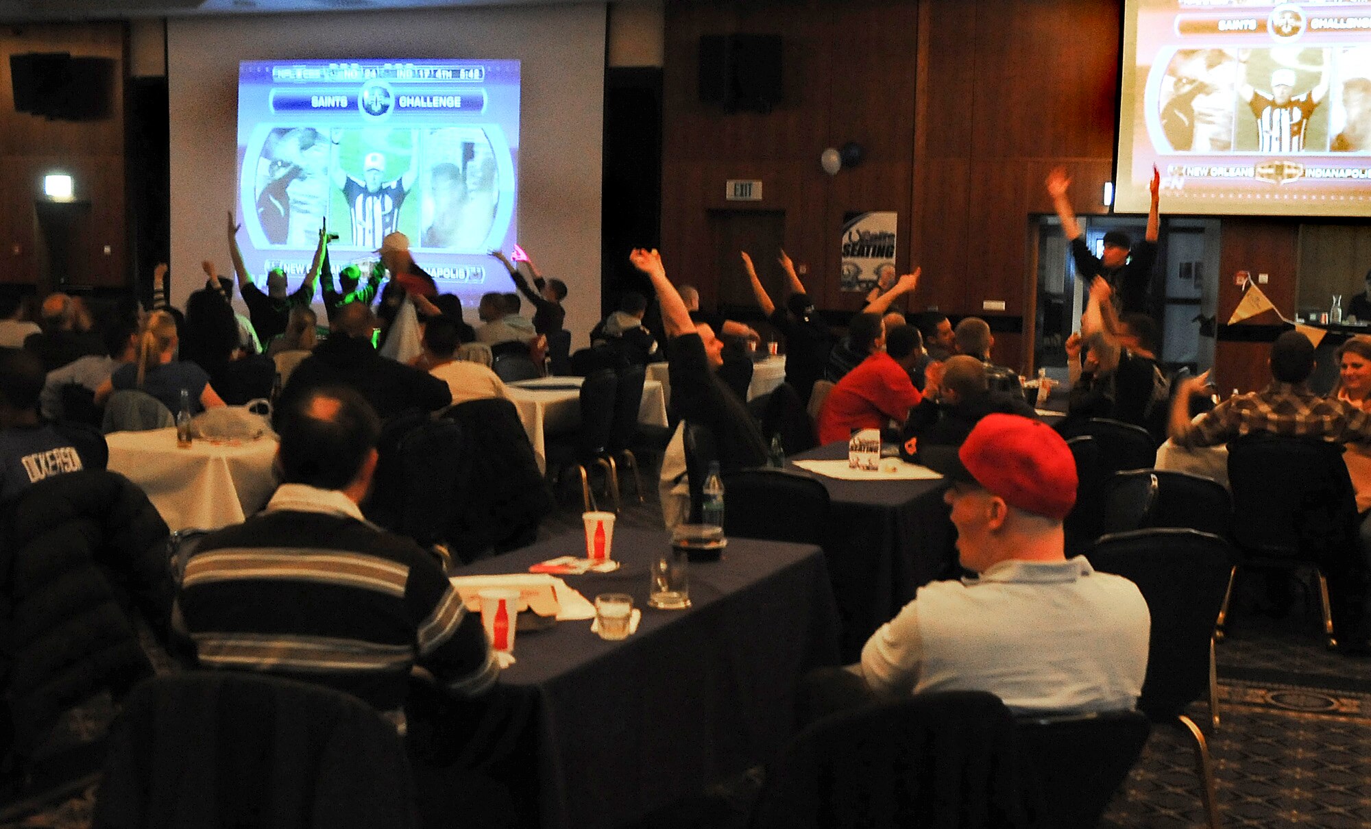 SPANGDAHLEM AIR BASE, Germany – New Orleans Saints fans celebrate after Saints cornerback Tracy Porter intercepts a touchdown pass late in the fourth quarter during the Super Bowl XLIV showing Feb. 7 at Club Eifel. Club Eifel hosted a Super Bowl party for members of the 52nd Fighter Wing, which included food, games and prizes. (U.S. Air Force photo/Senior Airman Nathanael Callon)