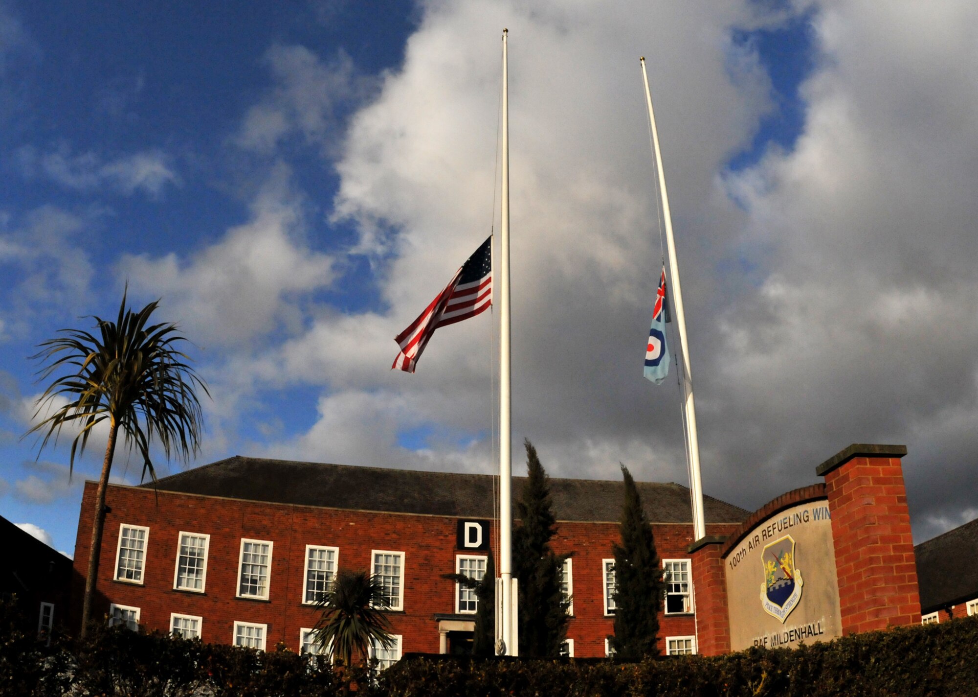 RAF MILDENHALL, England – The United States and Royal Air Force flags fly at half-staff outside the 100th Air Refueling Wing command building Feb. 9.  The flags were lowered to honor Rep. John Murtha, a Democratic congressman from Pennsylvania, who passed away Feb. 8 at age 77.  According to Title 4 of the United States Code, the U.S. flag is lowered to half-staff on the day of and one day after the death of any member of Congress.  (U.S Air Force photo by Staff Sgt. Jerry Fleshman)