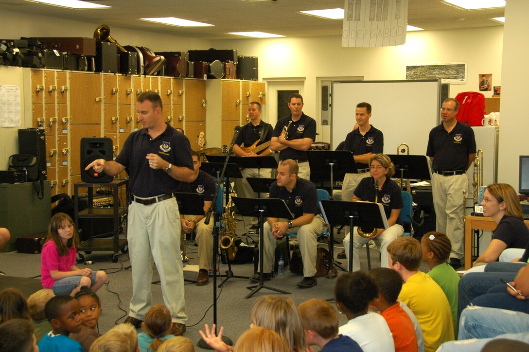Check Six, SSgt, Gene Dooley, talking to DoDDs music students at Lajes High School, Azores, during a performance/clinic.