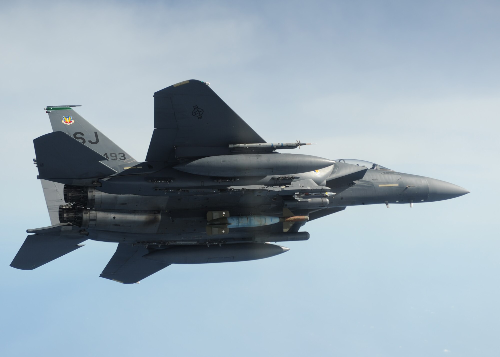 A 4th Fighter Wing F-15E Strike Eagle soars over the Eglin Air Force Base, Fla., range during a Combat Hammer mission Feb. 3.  Combat Hammer is an Air-to-Ground Weapons System Evaluation Program controlled by the 86th Fighter Weapons Squadron.  The F-15s from Seymour Johnson AFB, N.C., participated in the week-long evaluation dropping GPS and laser-guided weapons.  The WSEP was the first evaluation of Small Diameter Bombs at Eglin and first evaluation of Laser Joint Direct Attack Munitions in a Combat Hammer.  The WSEP program, run by the 53d Weapons Evaluation Group, is used to evaluate the effectiveness and suitability of combat air force weapon systems. The evaluations are accomplished during tactical deliveries of fighter, bomber and unmanned aerial system precision guided munitions, on realistic targets with air-to-air and surface-to-air defenses. For many of the aircrew participating in WSEP, it is the first time employing live weapons. This provides a level of combat experience many units face during combat.  (U.S. Air Force photo/Maj. Scott Alford.)