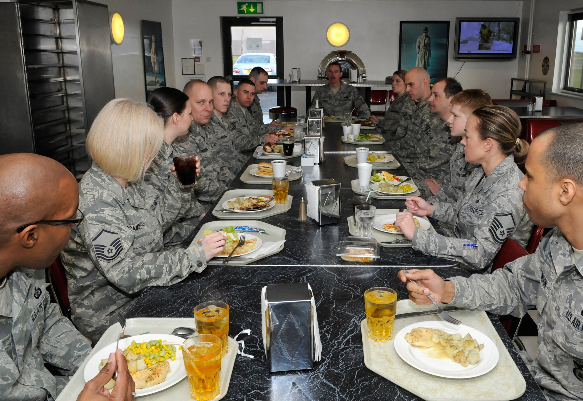 RAF MILDENHALL, England -- Chief Master Sgt. Dennis Vannorsdall, 3rd Air Force Command Chief, eats lunch with outstanding performers from the 100th Air Refueling Wing at the Hardstand Cafe Feb. 9.  (U.S. Air Force photo/Staff Sgt. Christopher L. Ingersoll)