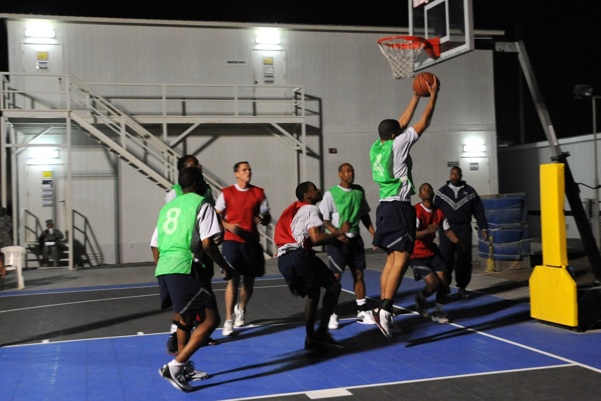A member of the 380th Expeditionary Civil Engineer squadron attempts to make a shot during the intramural basketball championshiop game against the 380th Expeditionary Security Forces Squadron at undisclosed location in Southwest Asia on Feb. 5, 2010. ECES won the game 30 to 24.(U.S. Air Force photo/Senior Airman Jenifer H. Calhoun/Released)

