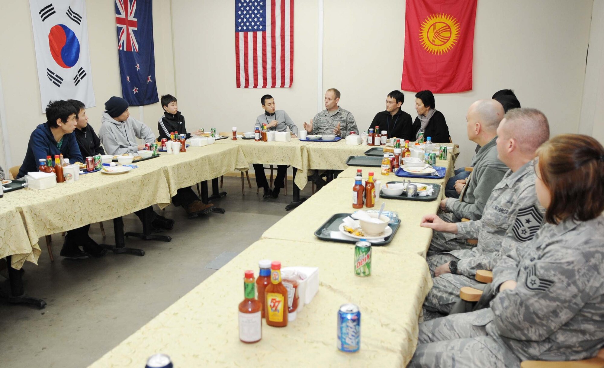 Col. Blaine Holt, 376th Air Expeditionary Wing commander, talks with members of the National Democratic Institute of Kyrgyzstan, who toured the Transit Center at Manas, Kyrgyzstan, Feb. 6, 2010, to get a better idea of the operations U.S. and coalition forces conduct here. (U.S. Air Force photo/Senior Airman Nichelle Anderson/released)
