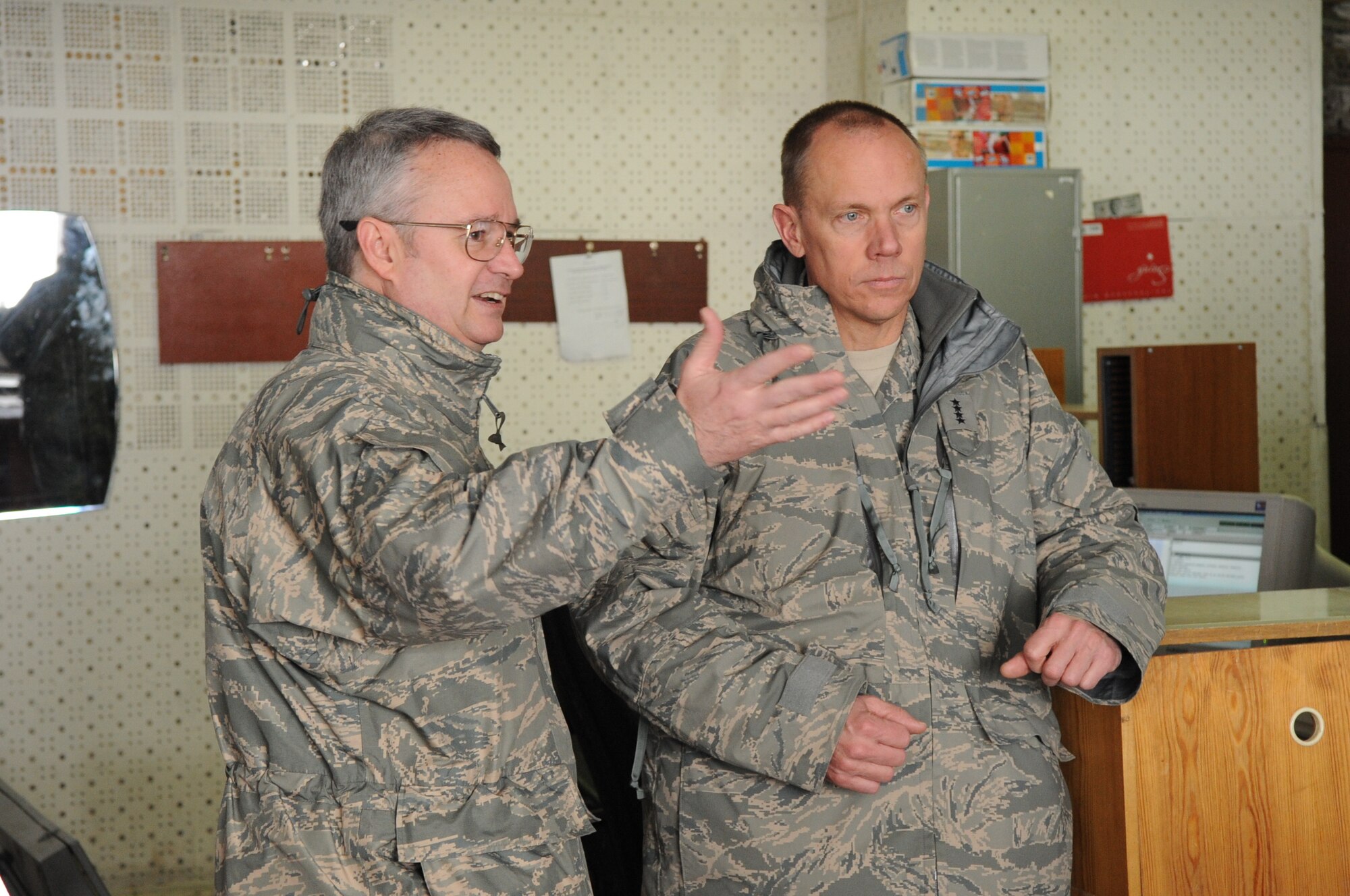 Lt. Col. John Esch, 376th Expeditionary Operations Support Squadron commander, briefs Gen. Donald Hoffman, Commander of Air Force Materiel Command, on the air traffic control operations at the Transit Center at Manas, Kyrgyzstan, Feb. 7, 2010. General Hoffman visited the Transit Center as part of a trip through the U.S. Central Command?s area of responsibility to acquire feedback directly from the warfighter about the test and sustainment support AFMC is contributing to the fight. (U.S. Air Force photo/Senior Airman Nichelle Anderson/released)
