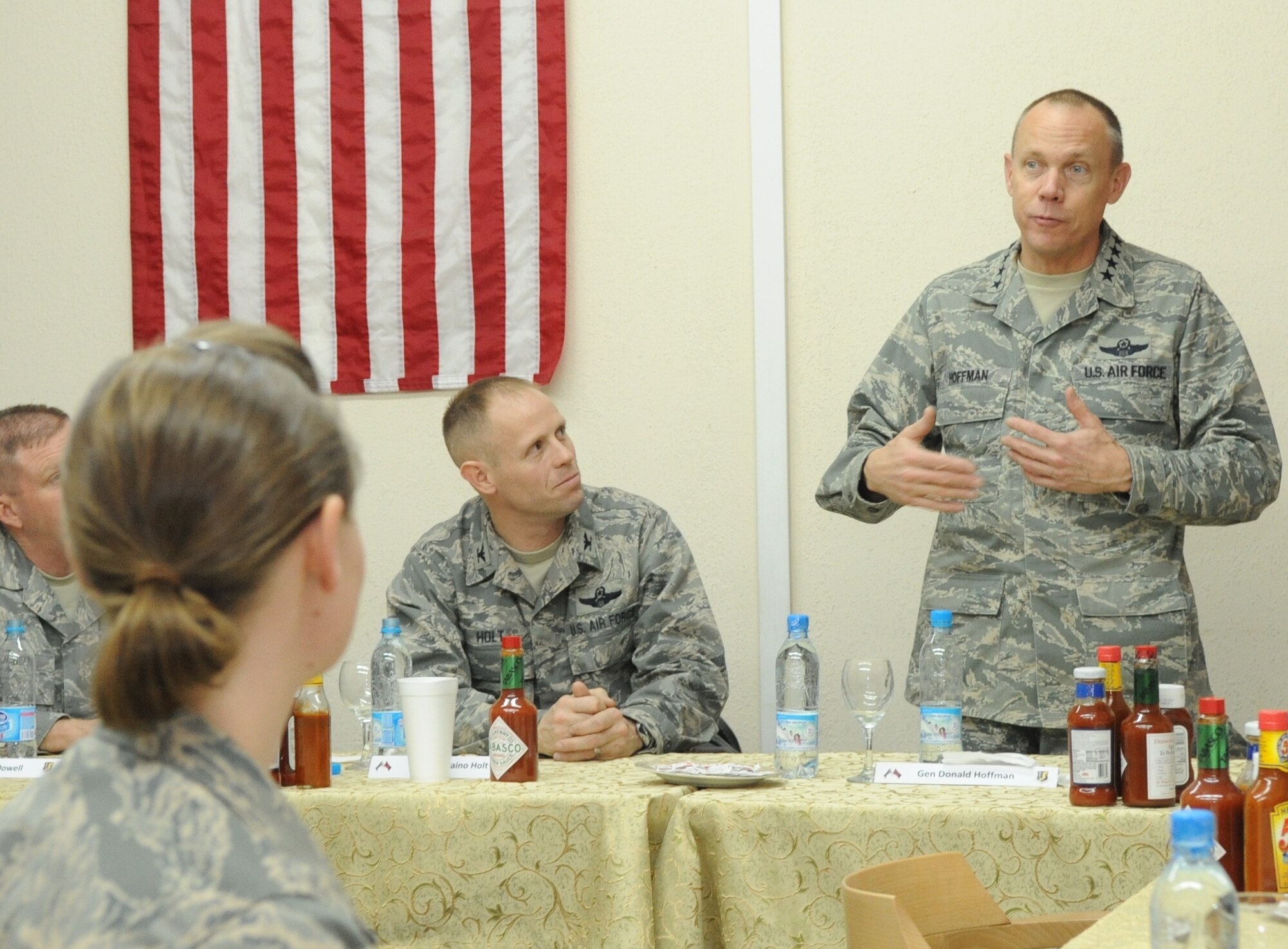 Gen. Donald Hoffman, Commander of Air Force Materiel Command, speaks to Airmen over dinner at the Transit Center at Manas, Kyrgyzstan, Feb. 6, 2010. General Hoffman visited the Transit Center as part of a trip through the U.S. Central Command?s area of responsibility to acquire feedback directly from the warfighter about the test and sustainment support AFMC is contributing to the fight.  (U.S. Air Force photo/Senior Airman Nichelle Anderson/released)