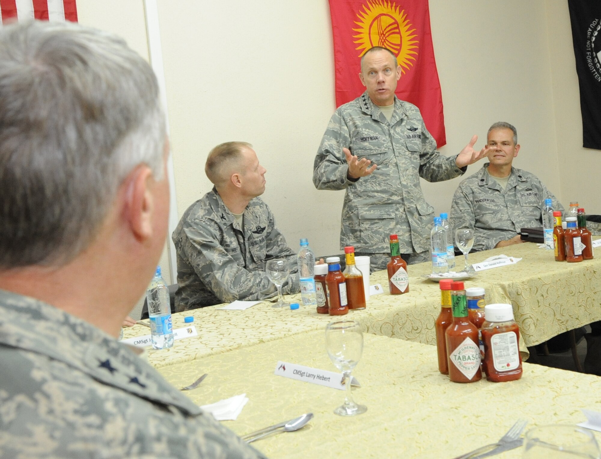 Gen. Donald Hoffman, Commander of Air Force Materiel Command, speaks to Airmen over dinner at the Transit Center at Manas, Kyrgyzstan, Feb. 6, 2010. General Hoffman visited the Transit Center as part of a trip through the U.S. Central Command?s area of responsibility to acquire feedback directly from the warfighter about the test and sustainment support AFMC is contributing to the fight.  (U.S. Air Force photo/Senior Airman Nichelle Anderson/released)