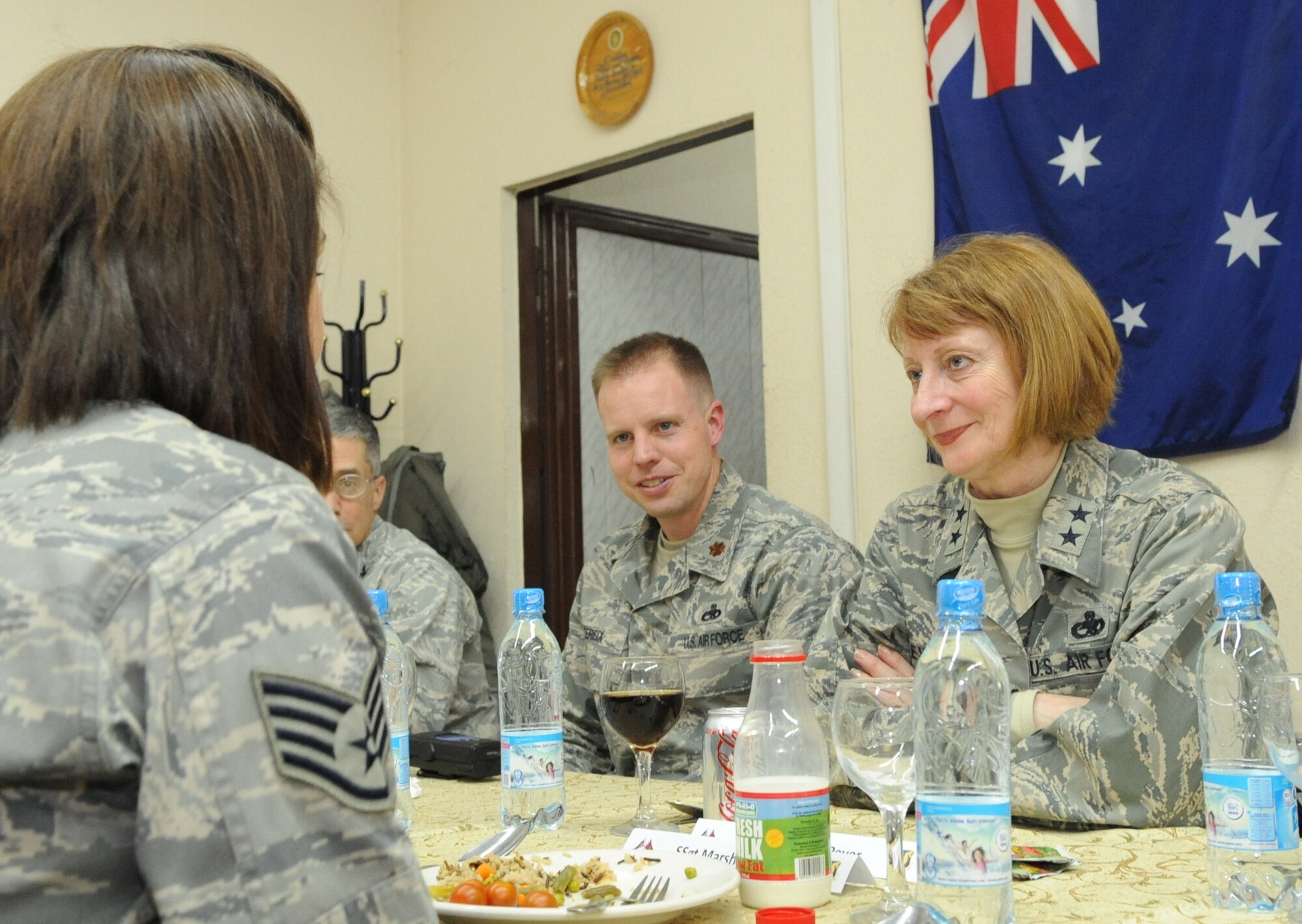 Maj. Gen. Polly Peyer, Commander, Warner Robins Air Logistics Center, Air Force Material Command, Robins Air Force Base, Ga., speaks with Airmen over dinner at the Transit Center at Manas, Kyrgyzstan, Feb. 6, 2010. General Peyer visited the Transit Center as part of a trip through the U.S. Central Command?s area of responsibility to acquire feedback directly from the warfighter about the test and sustainment support AFMC is contributing to the fight.  (U.S. Air Force photo/ Senior Airman Nichelle Anderson/released)