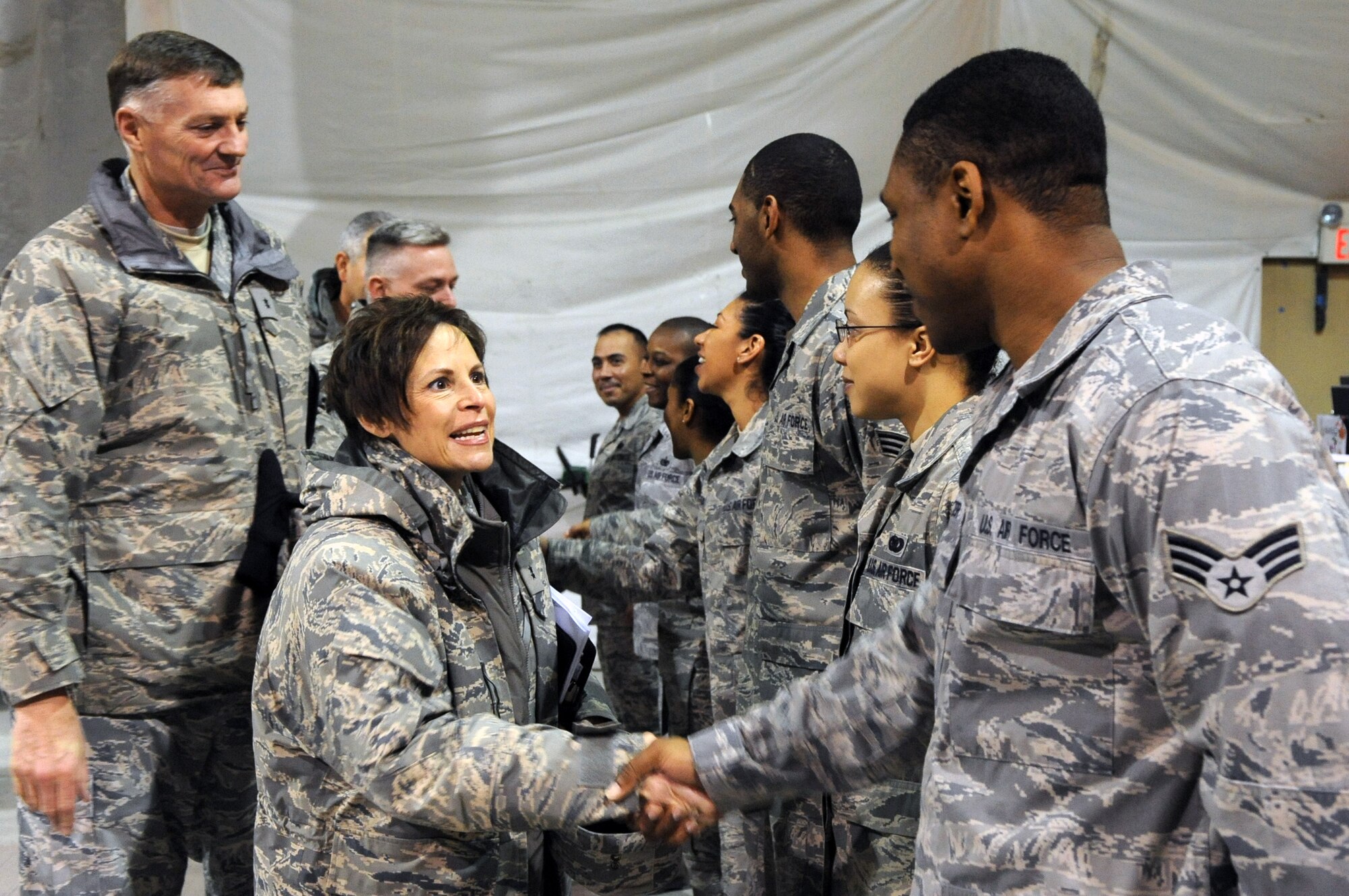 Maj. Gen. Kathleen Close, Director, Logistics and Sustainment, Headquarters Air Force Materiel Command, Wright-Patterson Air Force Base, Ohio, greets 376th Expeditionary Logistics Readiness Squadron Expeditionary Theater Distribution Center Airmen at the Transit Center at Manas, Kyrgyzstan, Feb. 7, 2010. General Close visited the Transit Center as part of a trip through the U.S. Central Command’s area of responsibility to acquire feedback directly from the warfighter about the test and sustainment support AFMC is contributing to the fight. (U.S. Air Force photo/Staff Sgt. Carolyn Viss/released)