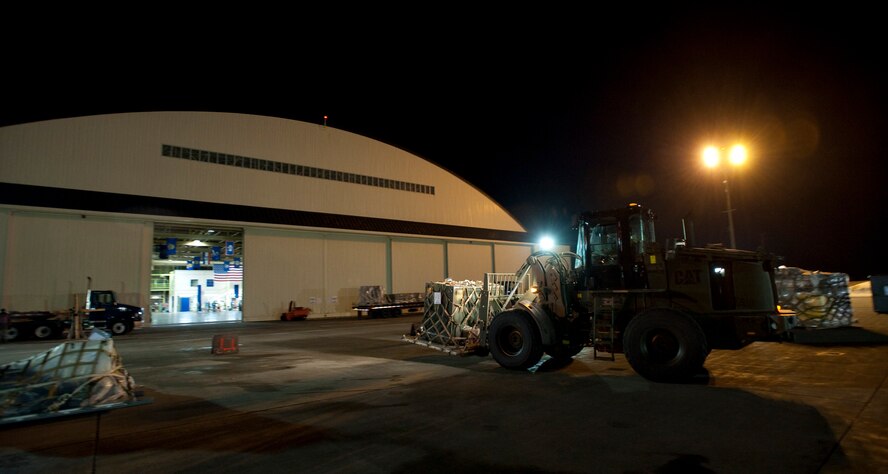 A 10,000-pound forklift brings an aircraft pallet into Hangar 949 during an operational readiness exercise Jan. 28, 2010, at Misawa Air Base, Japan. The 35th Logistics Readiness Squadron cargo deployment function works around-the-clock to make sure necessary equipment and cargo are ready for flight. (U.S. Air Force photo/Staff Sgt. Samuel Morse) 

