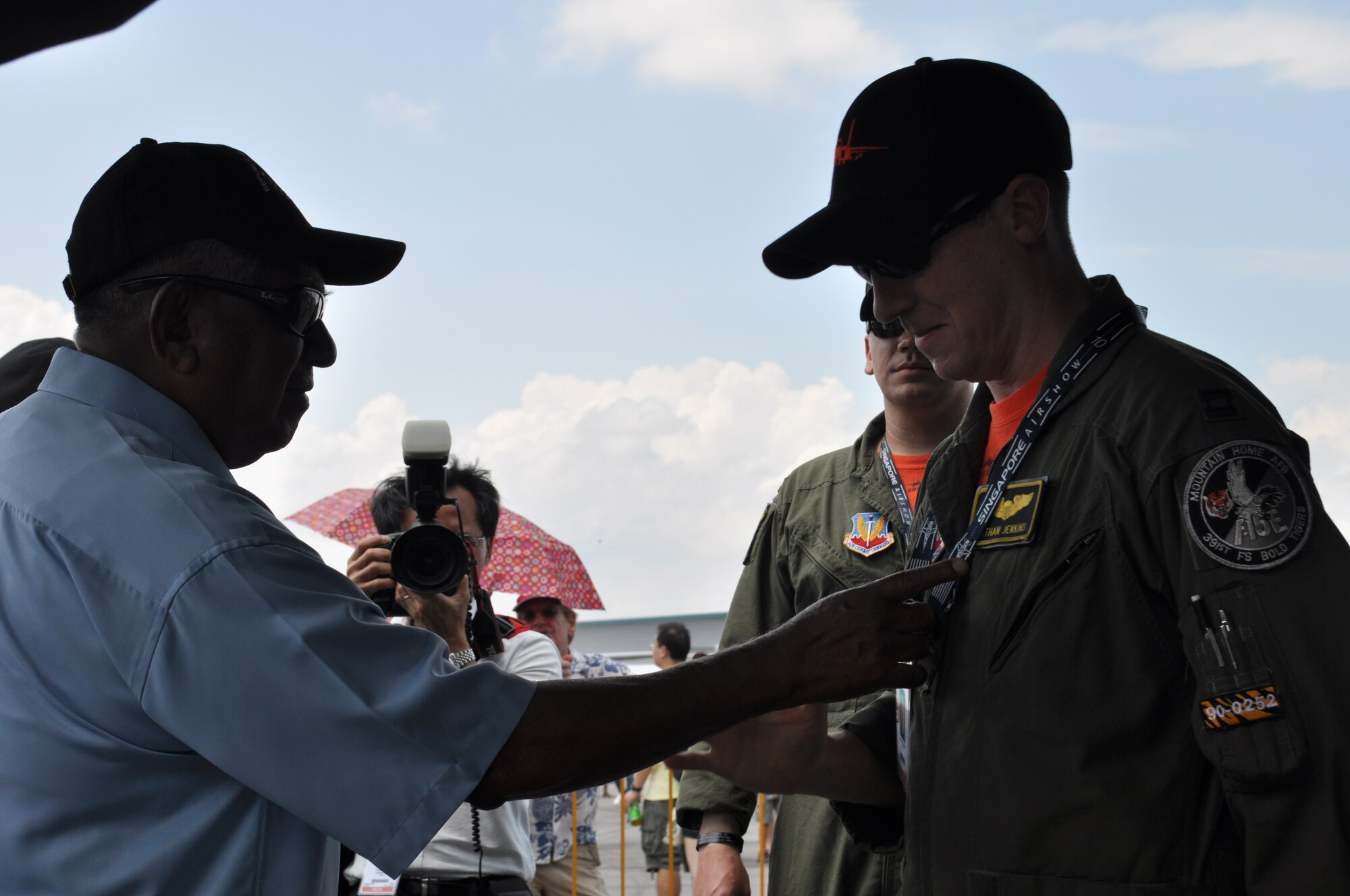 Singapore President S. R. Nathan jokes with Capt. Nathan Jenkins, an F-15E Strike Eagle pilot from the 391st Fighter Squadron at Mountain Home Air Force Base, Idaho, about both sharing the same name during Singapore Airshow 2010 in Changi, Singapore, Feb. 7. Aircraft from the United States participated in both static displays and aerial demonstrations to exhibit a snapshot of the diverse inventory of U.S. military aircraft and equipment. U.S. Pacific Command's participation in the six-day air show directly supports U.S. engagement goals and furthers U.S. relations with countries in the Asia-Pacific region. (U.S. Air Force photo/MSgt. Sgt. Allison Day)