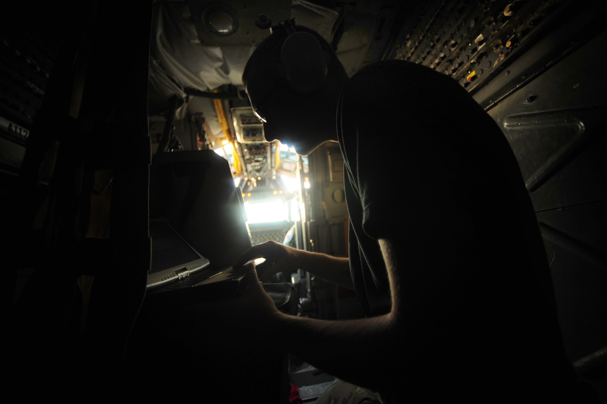 U.S. Air Force Senior Airman Crispin Hasley, a guidance and control systems specialist assigned to the 36th Aircraft Maintenance Squadron, Anderson Air Force Base, Guam, reviews flight information aboard a B-52 Stratofortress prior to a mission in support of Exercise Cope North, Feb. 9, 2010. The B-52 aircraft is assigned to the 20th Expeditionary Bomb Squadron, Barksdale AFB, La. The United States Air Force and the Japanese Air Self-Defense Force conduct Cope North annually to increase combat readiness and interoperability, concentrating on coordination and evaluation of air tactics, techniques and procedures.  The ability for both nations to work together increases their preparedness to support real-world contingencies.  (U.S. Air Force photo by Staff Sgt. Jacob N. Bailey)
