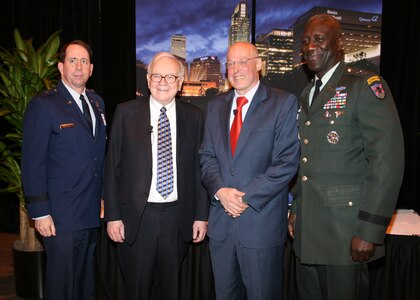 OMAHA, Neb. - Army Maj. Gen. Abraham J. Turner (right), chief of staff, U.S. Strategic Command and Brig. Gen. John Shanahan(left), 55th Wing Commander, Offutt Air Force Base stand with Warren Buffett, CEO of Berkshire Hathaway, and the Honorable Henry M. Paulson, Jr., 74th U.S. Treasury Secretary, at the Omaha Chamber of Commerce meeting, held at the Qwest Center Tuesday.<br><br>The annual meeting recognizes outstanding achievements by the business community&#039;s leaders and organizations.