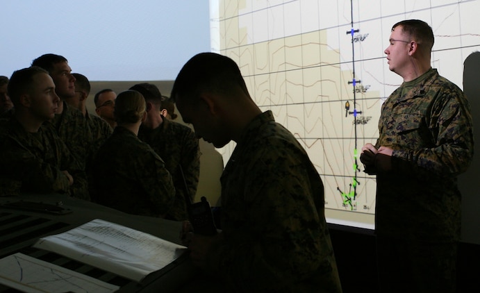 Sgt. Jeremiah M. Gerstner, 1st Platoon sergeant, Military Police Company, Combat Logistics Regiment 27, 2nd Marine Logistics Group, debriefs his Marines after conducting combat convoy simulation training here, Feb. 17-19, 2010.  The CCS trainers provide an immersive training environment for convoy operations to include basic procedures for driver, gunner, and passengers in tactical scenarios, related to combat operations.