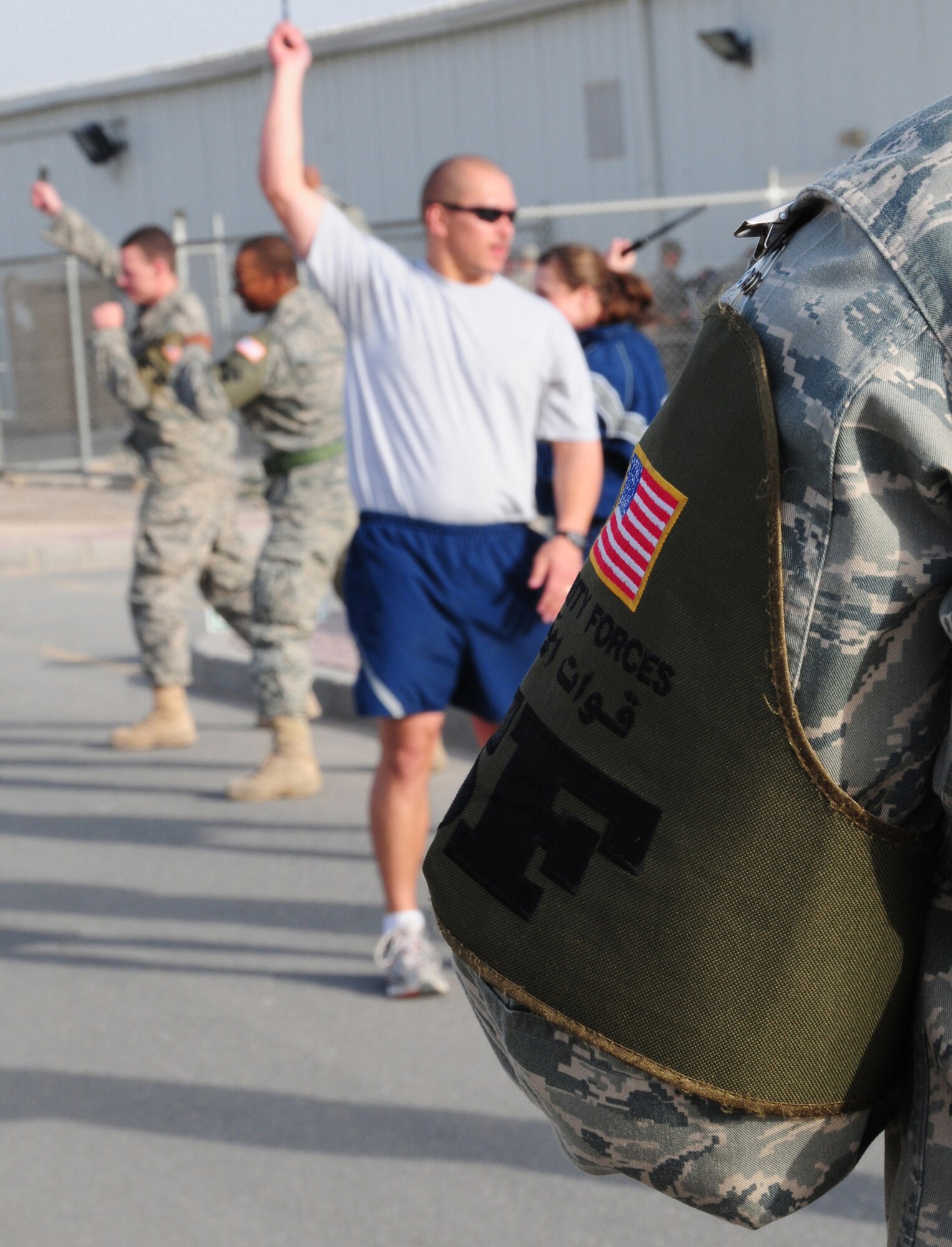 U.S. Air Force Tech. Sgt. Eric Bosley, 386th Expeditionary Security Forces Squadron Force Protection asp training instructor, recites commands to force protection Airmen during a class Feb. 9, 2010 at an air base in Southwest Asia. The 386th ESFS Force Protection course is designed to prepare Airmen to handle any hostile situation that may arise during their time downrange. (U.S. Air Force photo by Staff Sgt. Lakisha A. Croley/Released)