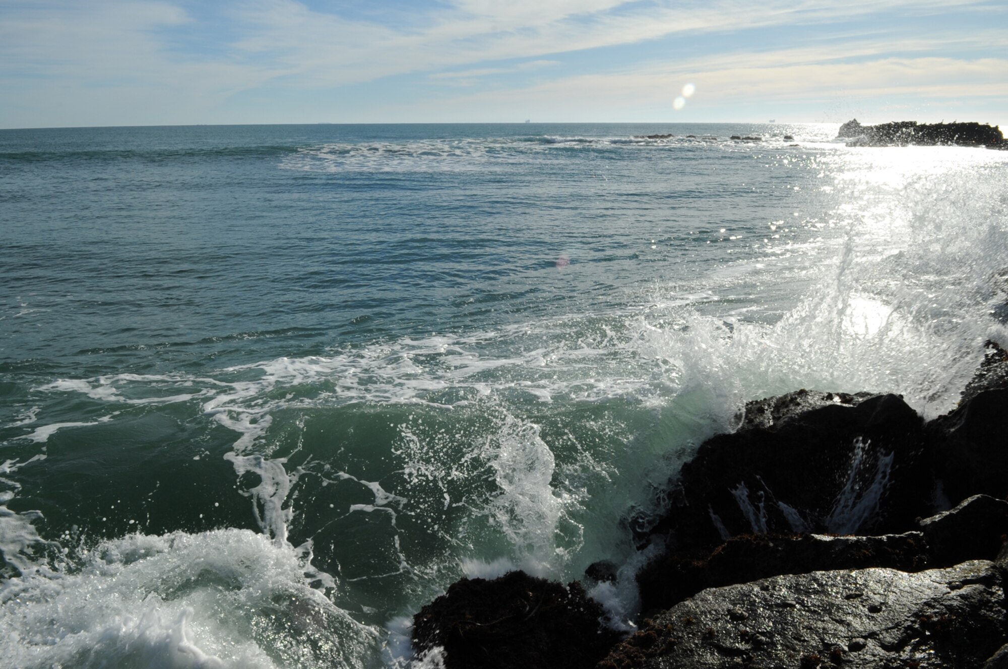 VANDENBERG AIR FORCE BASE, Calif.-- Waves crash against rocks near a boathouse here Thursday, Jan. 28, 2010. This picture shows a southwest view of the Pacific Ocean where Pacific Gas and Electricity Company plans to test wave energy technology. (U.S. Air Force photo/Senior Airman Bryan Boyette)