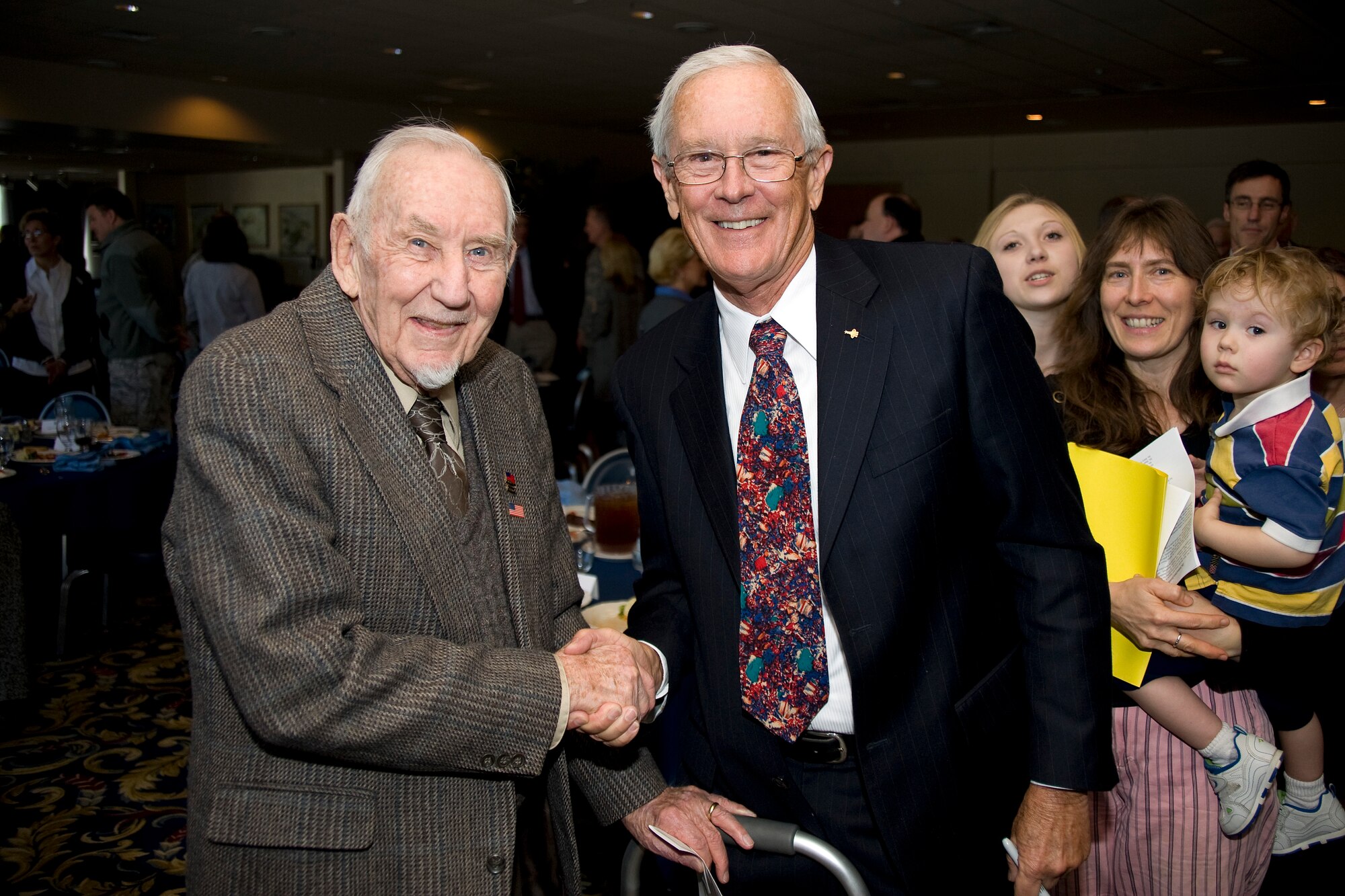 Retired Brig. Gen. Charles Duke Jr., right, poses for a photo with John Eck at the Air Force Academy's National Prayer Luncheon Feb. 9, 2010. General Duke, a former astronaut who walked on the Moon's surface, was the luncheon's guest speaker. Mr. Eck is a survivor of the Dec. 7, 1941 attack on Pearl Harbor. (U.S. Air Force photo/Bill Evans)