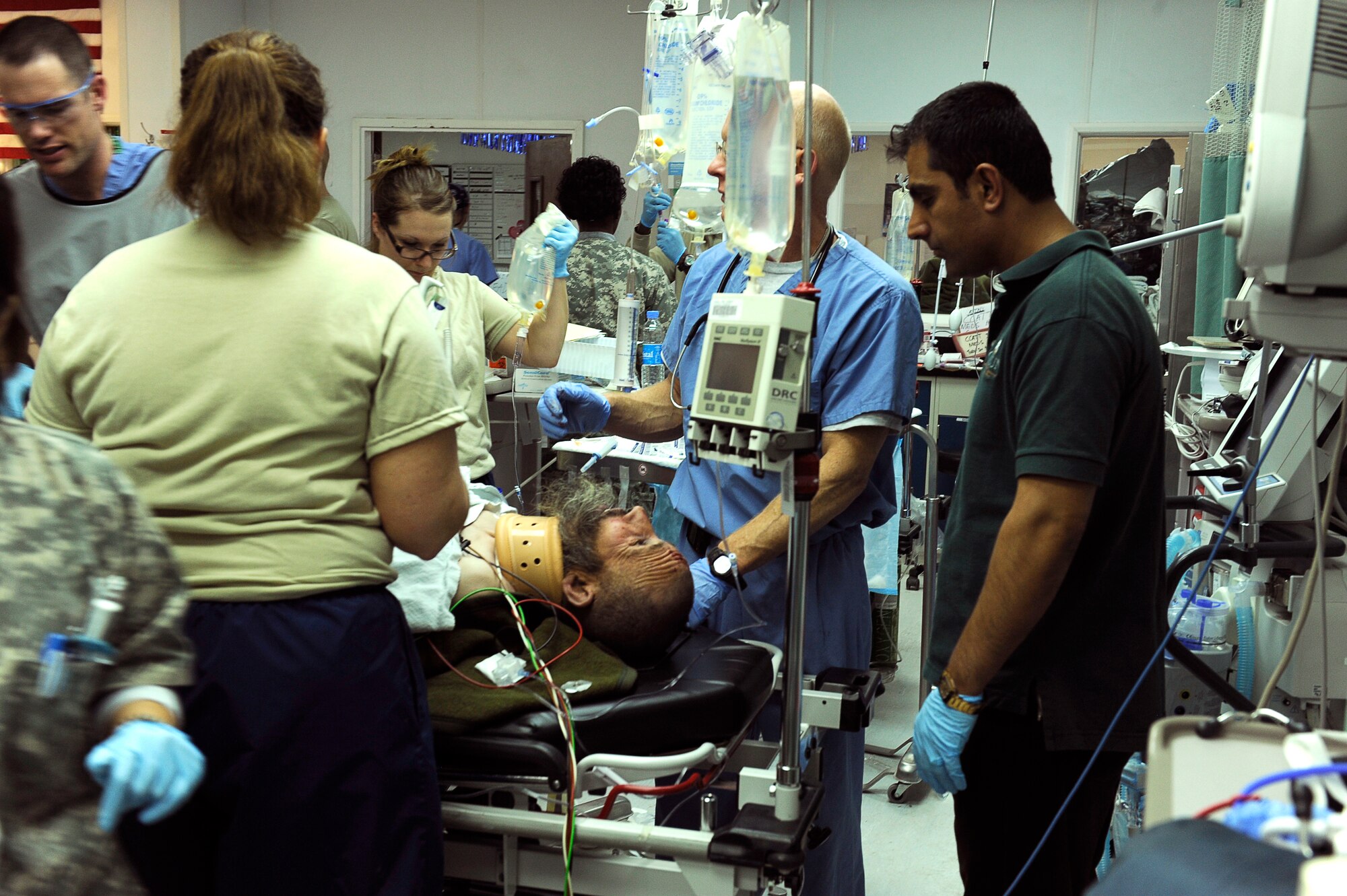 Airmen from the 455th Expeditionary Medical Group work in the emergency room to save avalanche victims who were medically evacuated Feb. 9, 2010, to Craig Joint Theater Hospital at Bagram Airfield, Afghanistan. Dozens of Afghans were taken to Bagram Airfield after avalanches struck a mountain pass in the Parwan Province. (U.S. Air Force photo by/Tech. Sgt. Jeromy K. Cross)