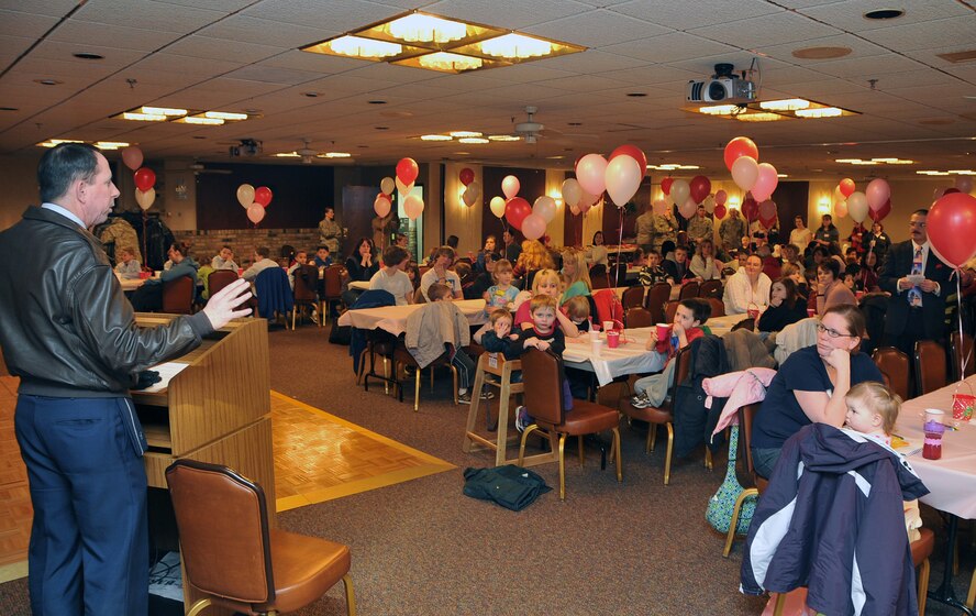 OFFUTT AIR FORCE BASE, Neb. -- Brig. Gen. John N.T. Shanahan, 55th Wing commander, speaks to family members of Offutt deployed personnel during the deployed family dinner Feb. 9 at the community center.  Organizations and volunteers from across Offutt and in the local community come together each quarter to plan an event for the families of deployed military members. This event featured a free dinner and games for children and educational guidance for spouses to help them with separation. U.S. Air Force photo by Jeff W. Gates.