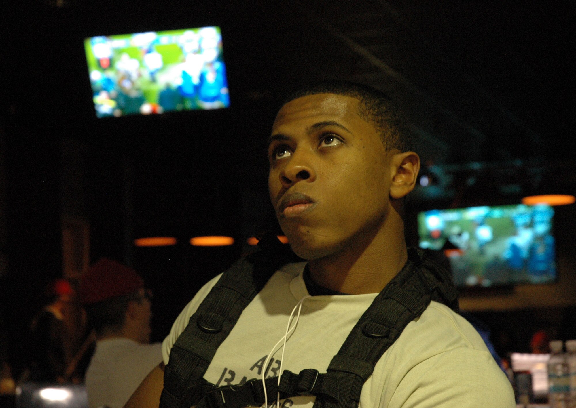 Airman Basic Damian Barnes, a tactical air control party  candidate, watches a professional football game during a party held at the Hurlburt Field Landing Zone Feb. 7. The center’s staff partnered with the base chapel to provide free pizza, soda and other snacks for Airmen to enjoy the game in a safe and alcohol-free environment. (U.S. Air Force photo by Airman 1st Class Joe McFadden)