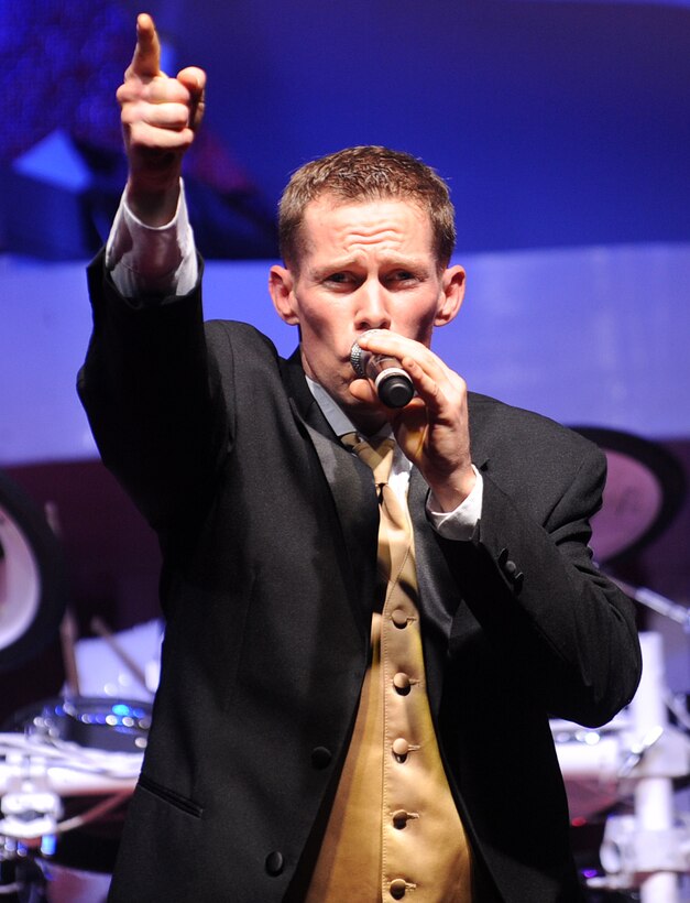 Hampton, Va. -- Staff Sgt. Timothy Womble, vocalist, sings during the Tops in Blue performance at the Hampton Roads Convention Center, Feb. 9. Tops in Blue, the Air Force’s premier entertainment group, is composed of vocalists and instrumentalists representing a wide range of career fields who tour all over the world captivating military and civilian audiences with high energy shows. (U.S. Air Force photo/Airman Rebecca Montez)