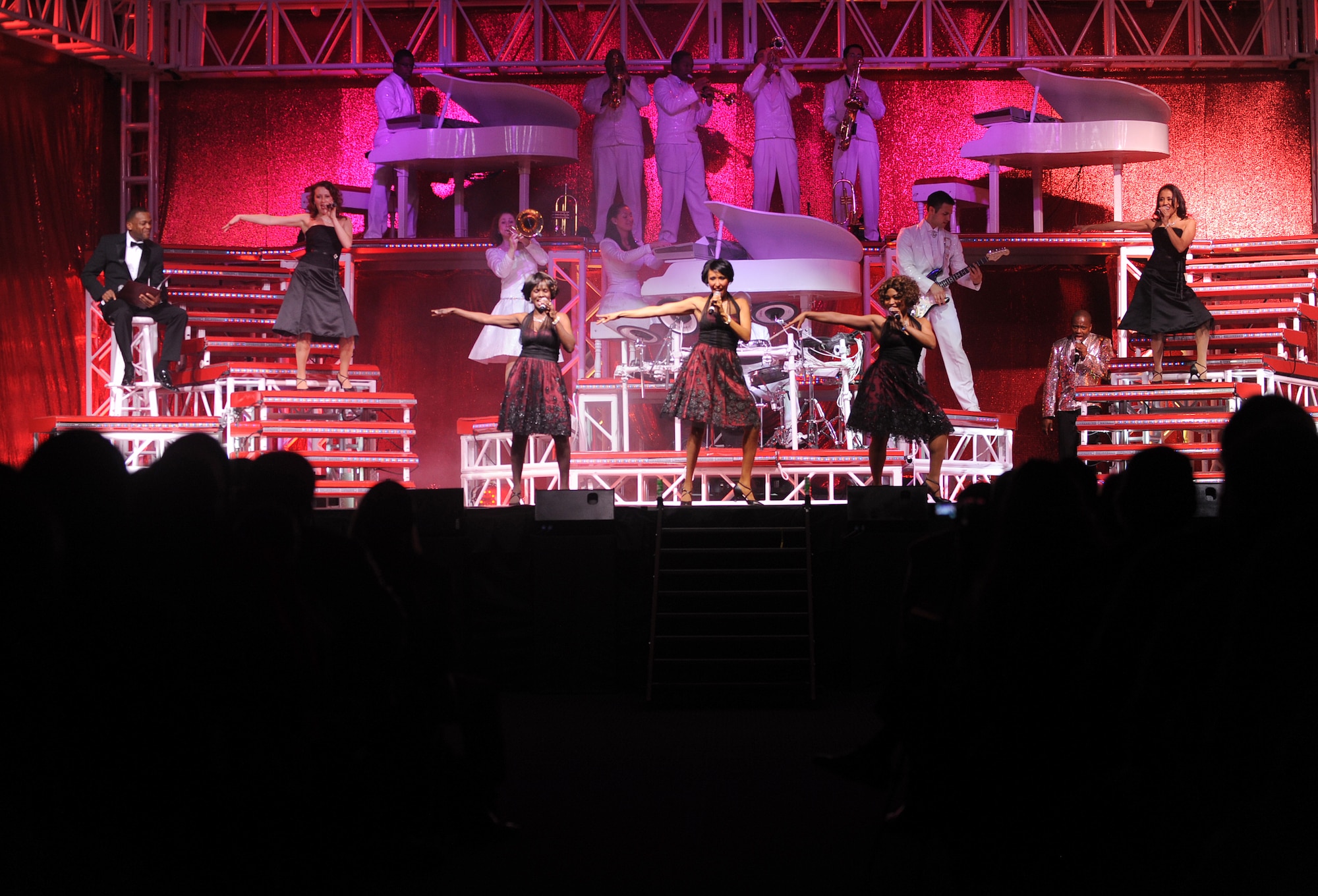 Hampton, Va. -- Tops in Blue performs for a full house at the Hampton Roads Convention Center Feb. 9. As the Air Force’s premier entertainment group, the band is composed of vocalists and instrumentalists representing a wide range of career fields who tour all over the world captivating military and civilian audiences with high energy shows. (U.S. Air Force photo/Airman Rebecca Montez)