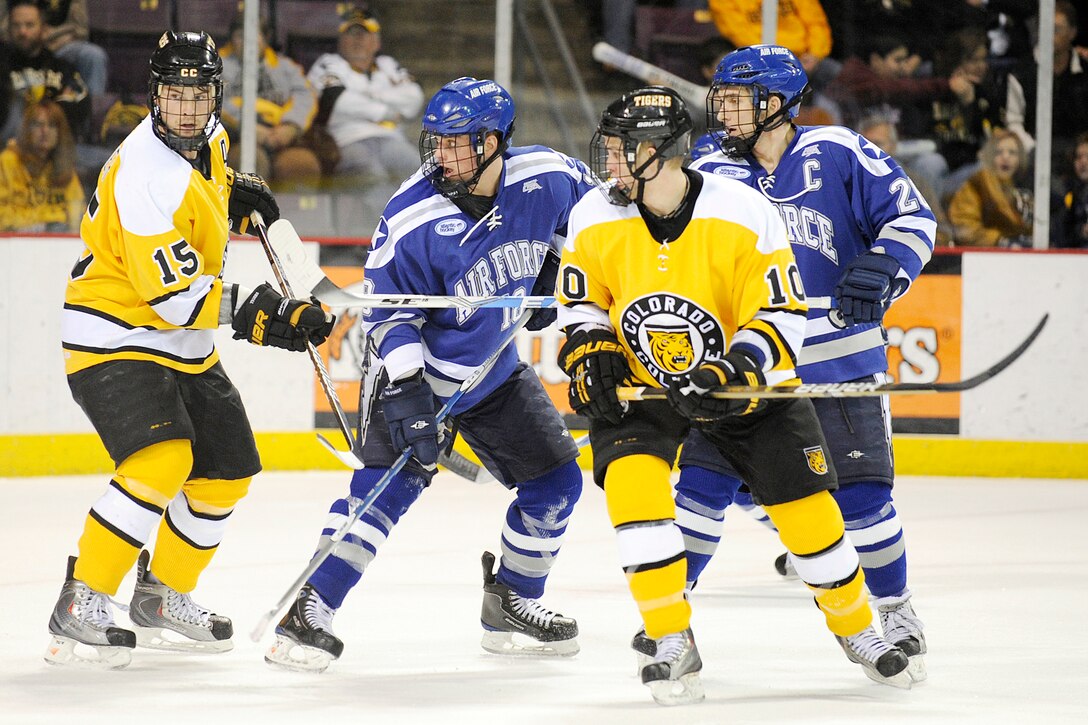 Colorado College's Gabe Guentzel and Nate Prosser  battle in front of the net with Falcons forwards Kyle De Laurell and Jeff Hajner as the Tigers beat Air Force 2-0 in a non-conference hockey game Feb. 5, 2010, at the World Arena in Colorado Springs, Colo..   (U.S. Air Force photo/Mike Kaplan)