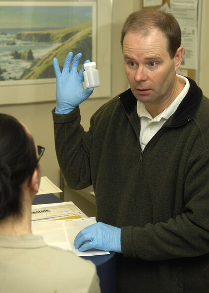 MINOT AFB, N.D. -- Mr. Vincent Tomasi, 5th Medical Group drug testing administration manager, briefs an airman on how to properly give a sample specimen Feb. 10. Airmen throughout the base are random selected by computer to participate in drug testing. (U.S. Air Force photo by Airman 1st Class Ashley N. Avecilla)