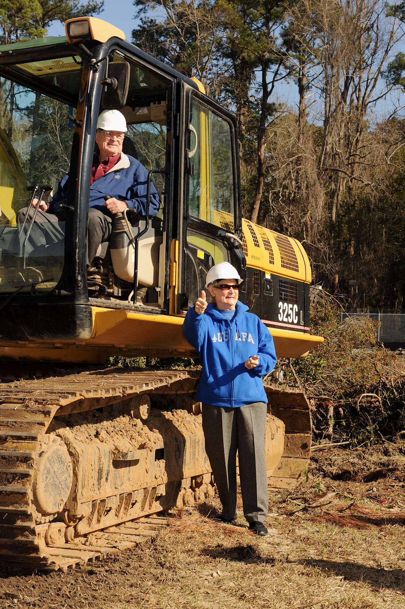 MOODY AIR FORCE BASE, Ga. -- Parker Greene, and his wife Dr. Lucy Greene, celebrate the demolition of the former wing leadership houses and the start of the new Child Development Center construction project here Feb. 8. The project is scheduled for completion in March 2011. (U.S. Air Force photo by Airman 1st Class Joshua Green) 
