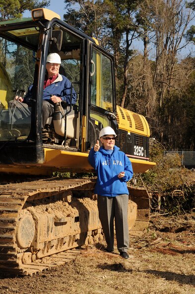 MOODY AIR FORCE BASE, Ga. -- Parker Greene, and his wife Dr. Lucy Greene, celebrate the demolition of the former wing leadership houses and the start of the new Child Development Center construction project here Feb. 8. The project is scheduled for completion in March 2011. (U.S. Air Force photo by Airman 1st Class Joshua Green) 
