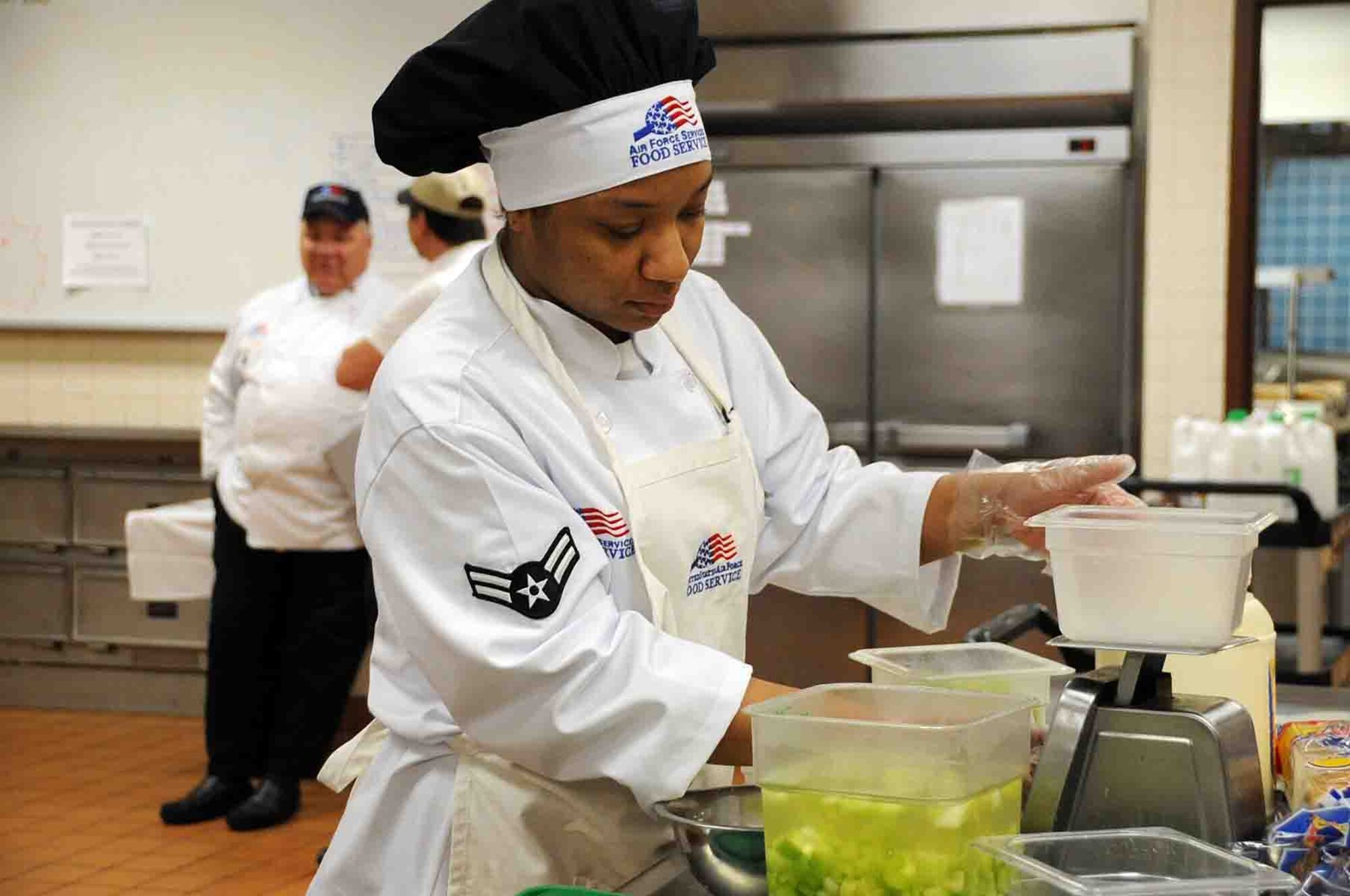 OFFUTT AIR FORCE BASE, Neb. -- Airman 1st Class Elizabeth Hall, a food service apprentice with the 55th Force Support Squadron, prepares lunch at the King Dining Facility here Feb. 8 during a visit by the 2010 Air Force Hennessey Evaluation Team. The Air Force evaluation team visited Offutt Feb. 6 - 10 in their quest to determine the best dining facilities in the Air Force. Offutt is competing against six other bases in the multi-facility category. The results of the competition are expected to be announced in April.  U.S. Air Force photo by Kendra Williams
