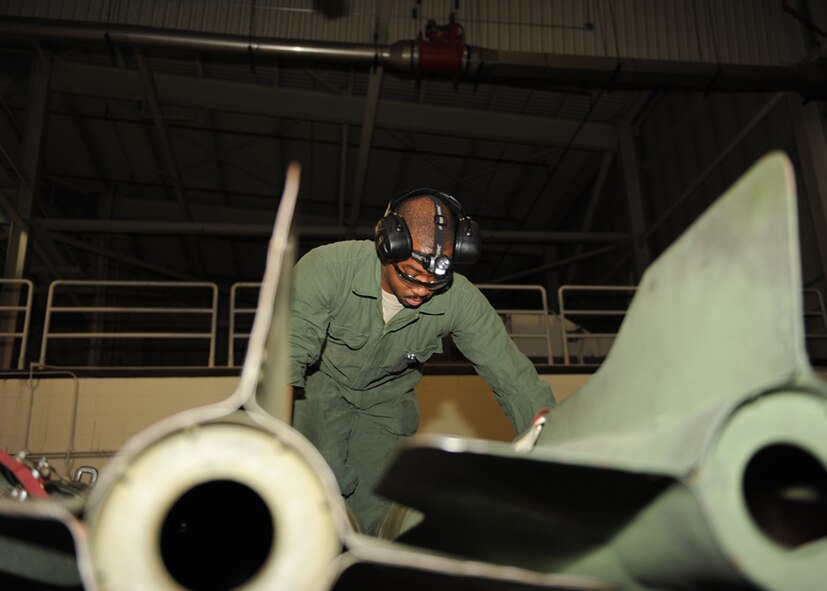 MINOT AIR FORCE BASE, N.D. -- Staff Sgt. Devonde Reuben, 5th Aircraft Maintenance Squadron armament systems team member, inspects training munitions during a load crew of the quarter competition here Feb. 5. Load crew competitions build camaraderie and ensure weapons Airmen maintain proficiency. (U.S. Air Force photo by Senior Airman Sharida Jackson)