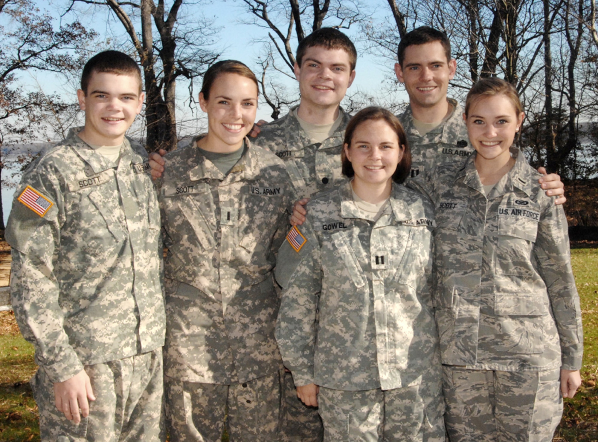 Clockwise from left, U.S. Military Academy Cadet Adam Scott, Army 1st Lt. Kerney Scott, now Army Reserve 2nd Lt. Alec Scott, Army Capt. Andy Scott, now Air Force Capt. Karoline Scott and Army Capt. Kate Gowel pose at their parents' house in Lorton, Va. The Scott children all chose to join the military, carrying on a legacy of active-duty service that's lasted more than 130 years. (Courtesy photo)