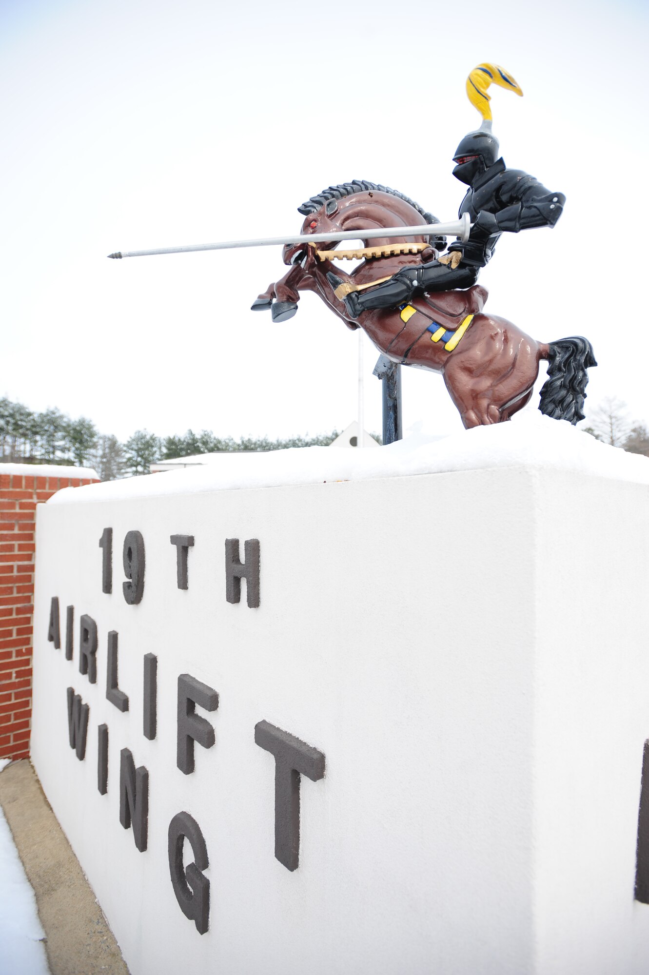 The 19th Airlift Wing black knight statue is frozen in place Feb. 10 following a snow storm on base Feb. 8 and 9. Several inches of snow covered Little Rock leaving heaps of snow and chilly weather. (U.S. Air Force photo by Senior Airman Steele Britton)