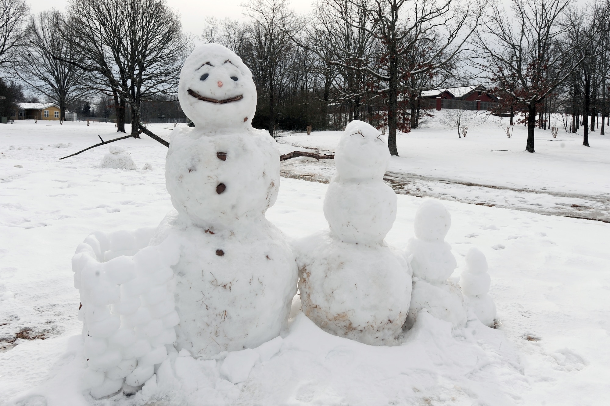 A family of snowmen keep cool at family housing on base Feb. 10. Several inches of snow covered Little Rock AFB, leaving heaps of snow and chilly weather. (U.S. Air Force photo by Senior Airman Steele Britton)
