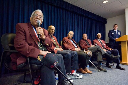 Tuskegee Airmen Thomas Ellis (left to right), Dr. Granville Coggs, Warren Eusan, Dr. Gene Derricotee and John "Mule" Miles answer questions from the audience after the second annual Tuskegee Heritage Breakfast Feb. 8 at the 99th Flying Training Squadron here. (U.S. Air Force photo/Steve Thurow)