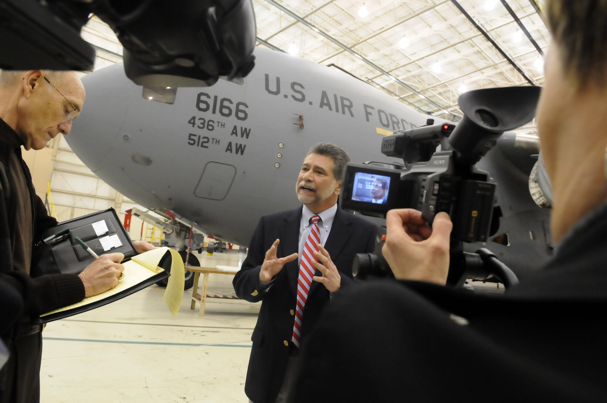 Gustavo Urzua talks with media after the ceremony commemorating the 200th C-17 delivery. U. S. Air Force photo by Sue Sapp