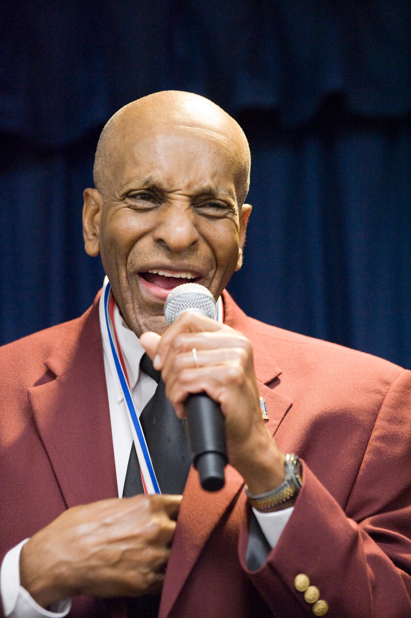 Dr. Granville Coggs, a Tuskegee Airman who served as a gunner, bombadier and pilot, speaks at the second annual Tuskegee Heritage Breakfast Feb. 8 at the 99th Flying Training Squadron here. (U.S. Air Force photo/Steve Thurow)