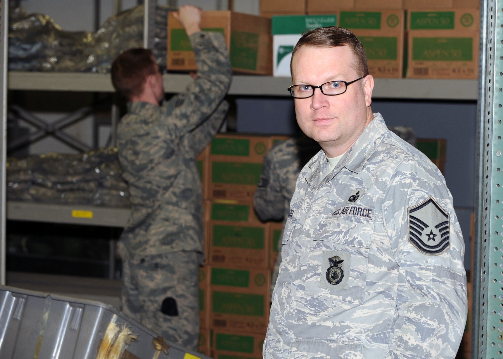 MINOT AIR FORCE BASE, N.D. -- Master Sgt. Christopher Kozel, 5th Security Forces Squadron resource advisor, is featured in his work center here Feb 9. Sgt. Kozel endured a long, intensive treatment regiment in his fight against stage 2-B lymphoma cancer, involving both chemotherapy and radiation therapy.  (U.S. Air Force photo by Staff Sgt. Keith Ballard))