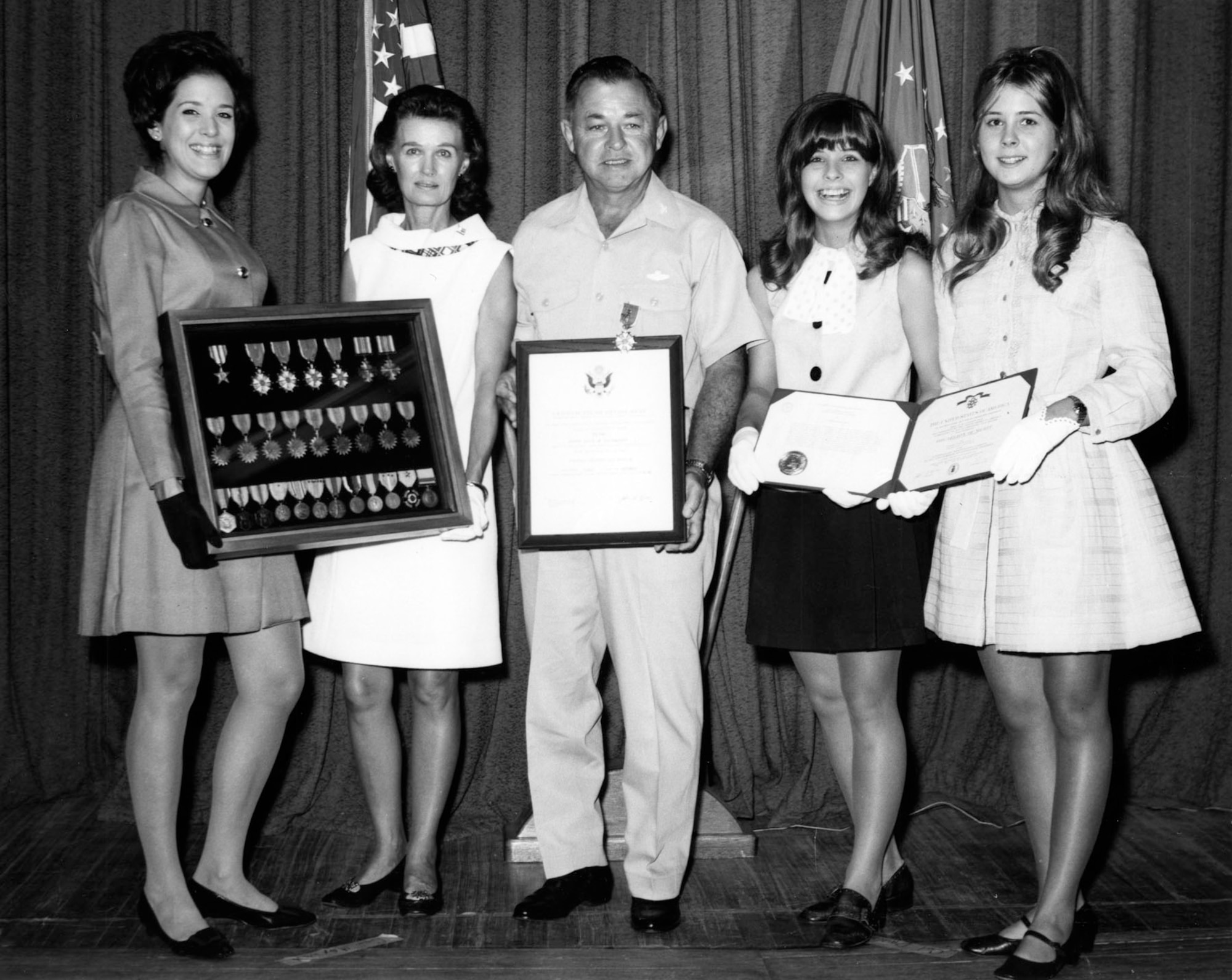 Col. Joe Davis Jr. at his retirement from the U.S. Air Force with his "Four Queens," (left to right) daughter Scott, wife Ann, and daughters Chris and Jan in 1969. (U.S. Air Force photo)
